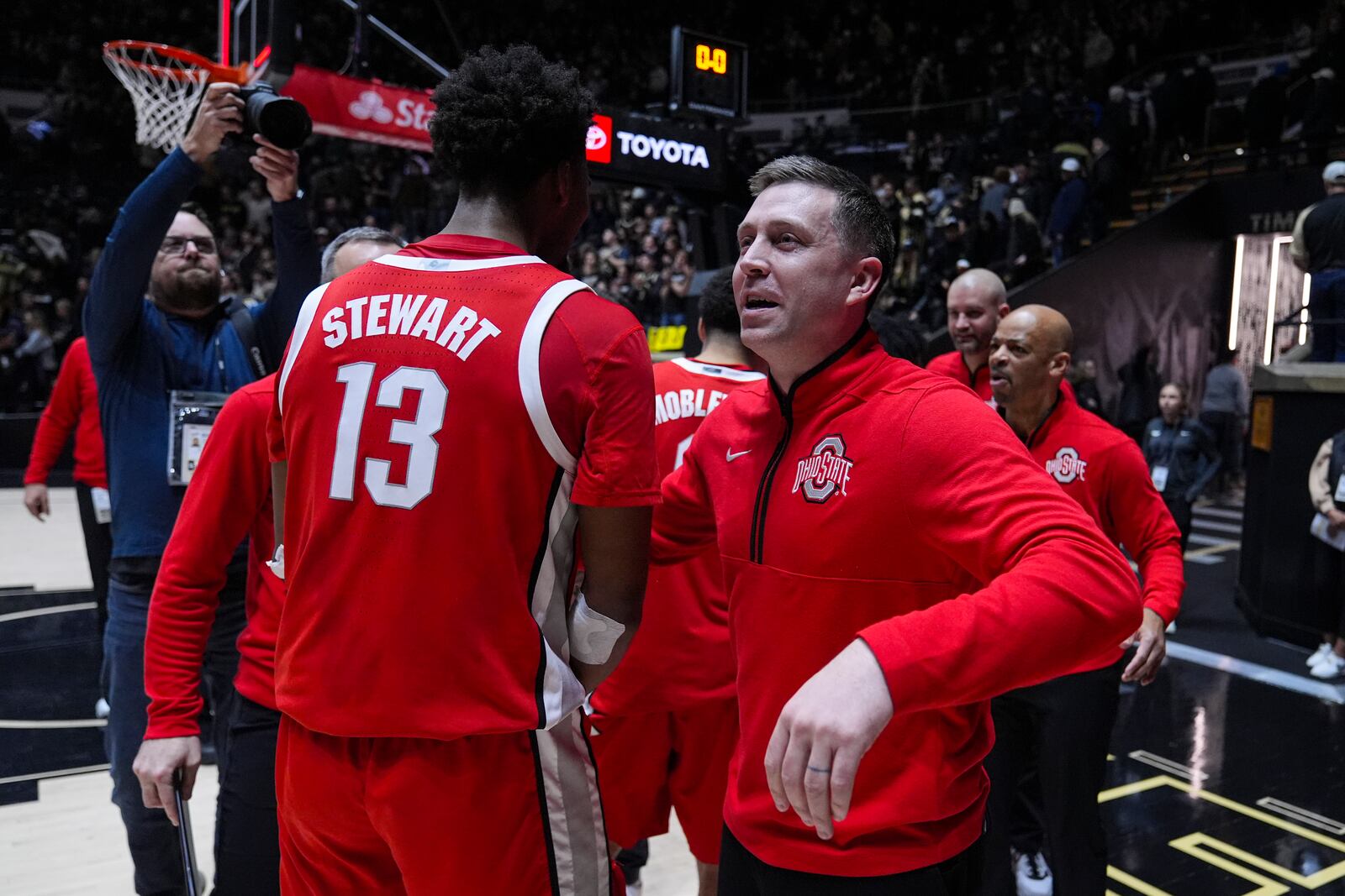 Ohio State head coach Jake Diebler celebrates with forward Sean Stewart (13) after defeating Purdue in an NCAA college basketball game in West Lafayette, Ind., Tuesday, Jan. 21, 2025. (AP Photo/Michael Conroy)