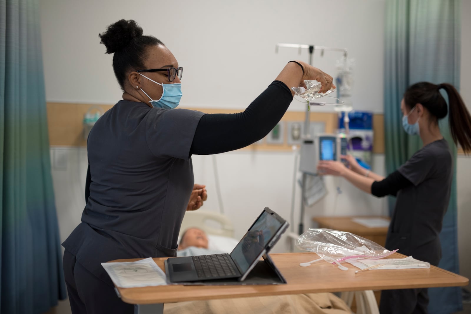 Sinclair nursing students work in a classroom setting. Sinclair is adding 18 new spots per year to its program. Courtesy of Sinclair Community College.