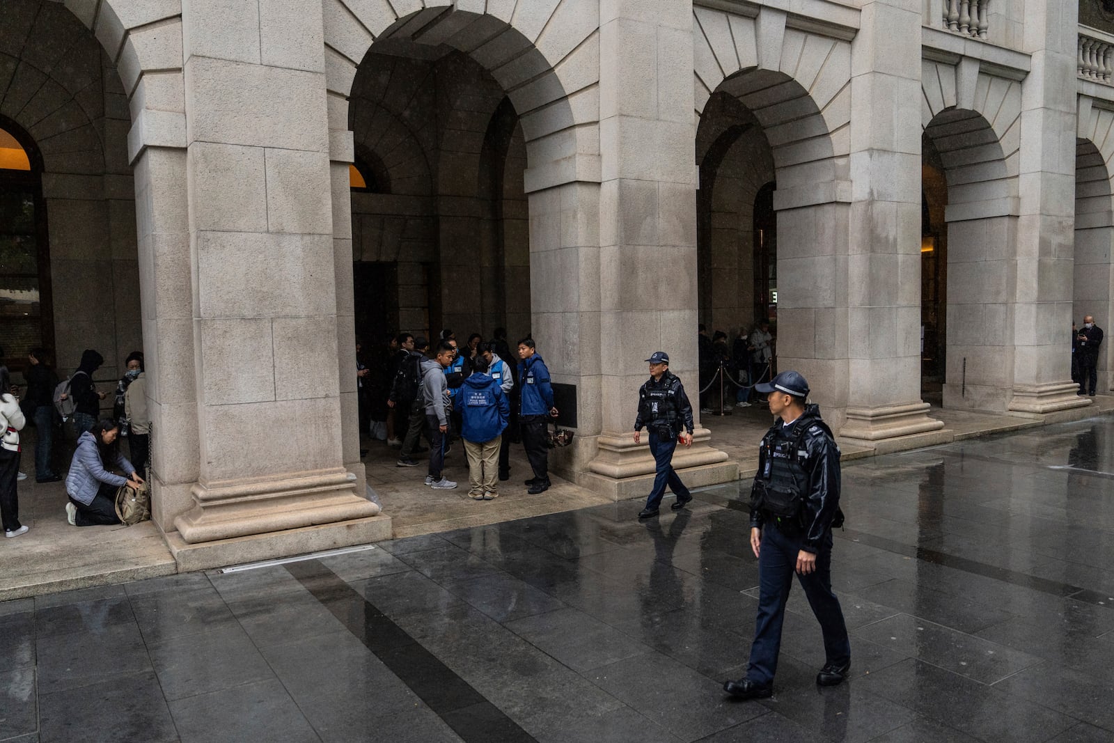 Police officers stand guard outside the Court of Final Appeal in Hong Kong, Thursday, March 6, 2025. Three former organizers of Hong Kong's annual vigil in remembrance of the 1989 Tiananmen Square crackdown won their bid at the top court on Thursday to overturn their conviction over their refusal to provide information to police, marking a rare victory for the city's pro-democracy activists. (AP Photo/Chan Long Hei)