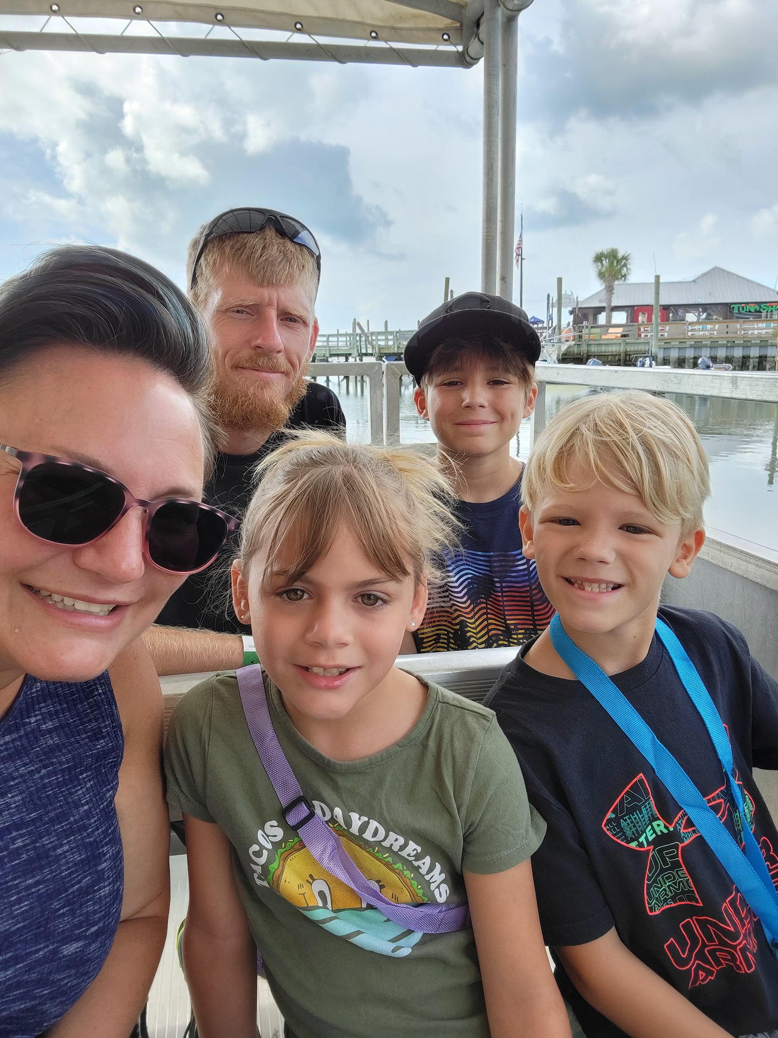 Carrie Graf on vacation with her family prior to her diagnosis. Seated on the row with her are daughter Charlotte and son Remy. Husband Perry and with son Owen are in the rear. CONTRIBUTED