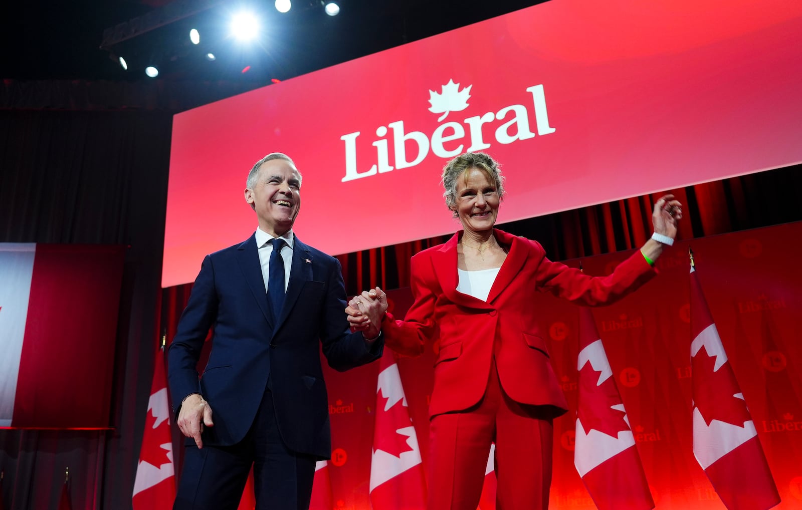 Liberal Party of Canada Leader Mark Carney is joined by his wife Diana Fox Carney after winning the party's leadership at the announcement event in Ottawa, Ontario, Sunday, March 9, 2025. (Sean Kilpatrick/The Canadian Press via AP)