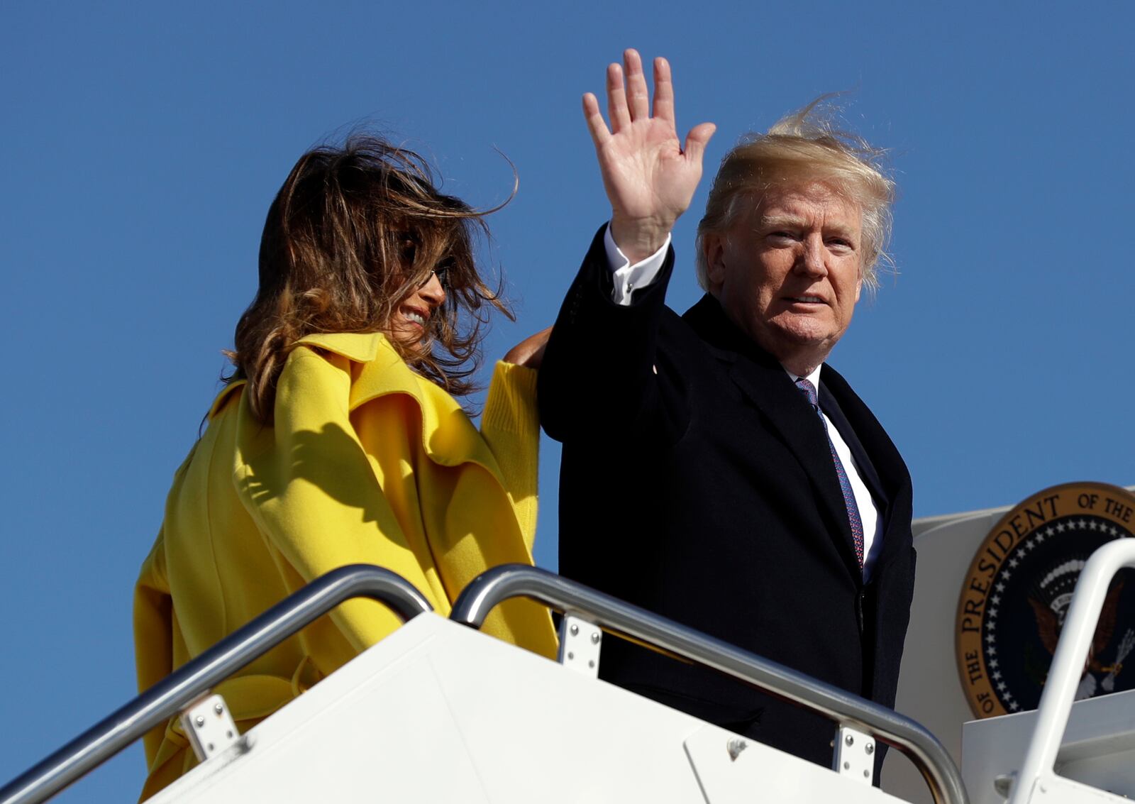 President Donald Trump and first lady Melania Trump board Air Force One for a trip to Cincinnati to promote his tax policy, Monday, Feb. 5, 2018, at Andrews Air Force Base, Md. (AP Photo/Evan Vucci)