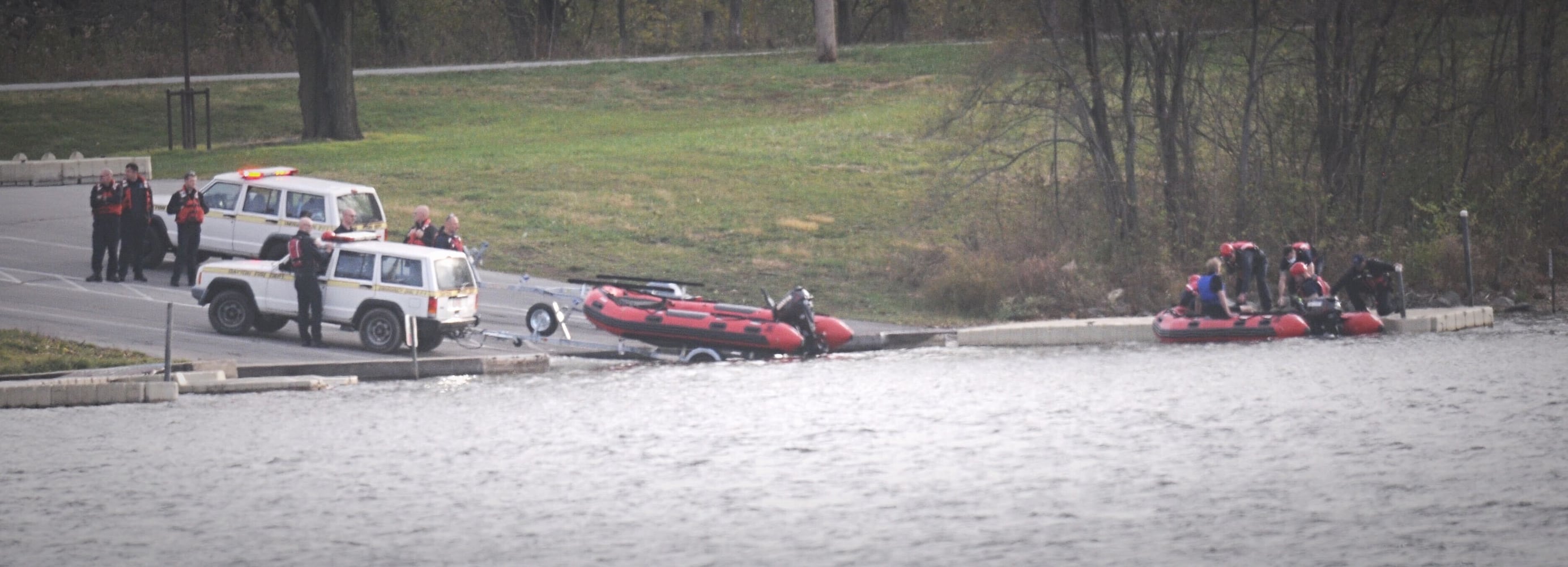 Man, dog rescued after boat overturns