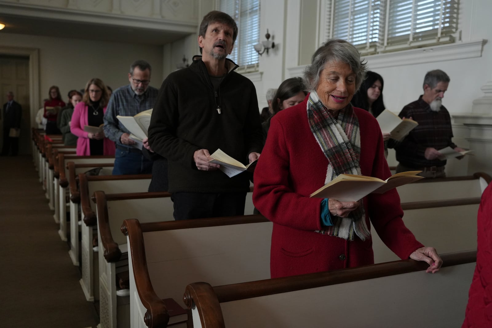 Central Moravian Church congregants sing at a “Lovefeast” service in Bethlehem, Pa., on Sunday, Dec. 1, 2024. (AP Photo/Luis Andres Henao)