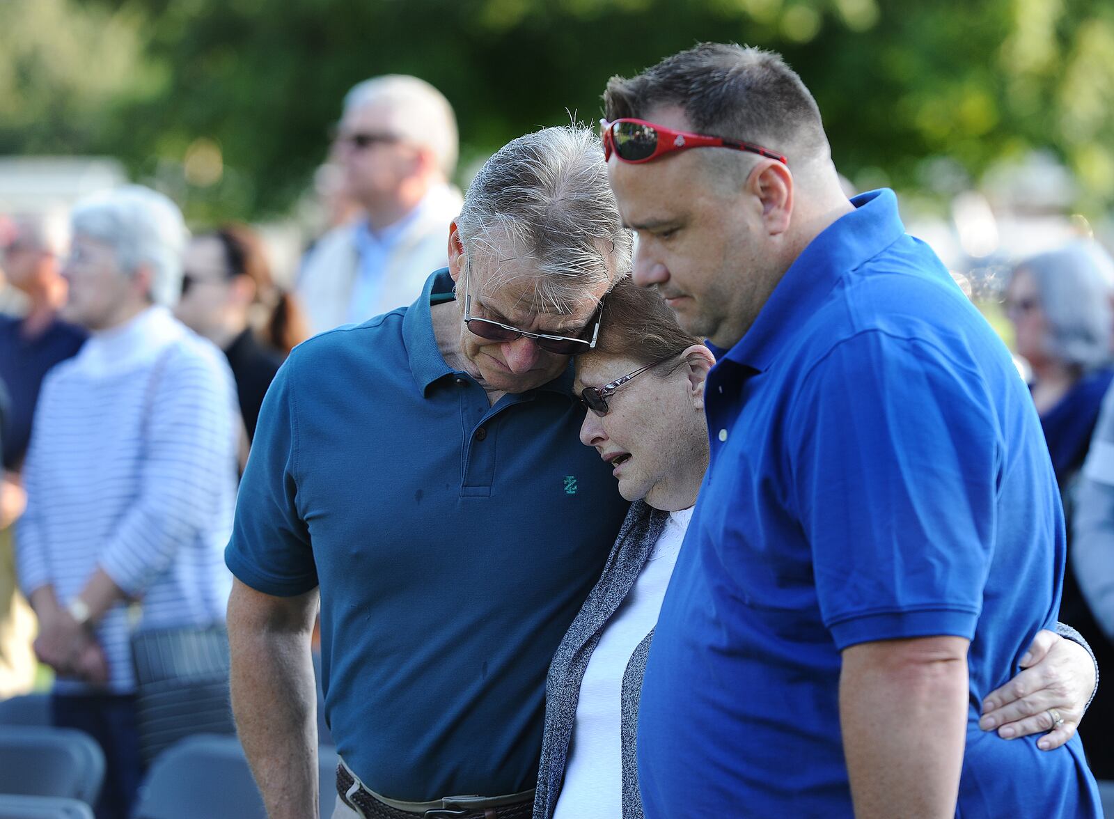 The Venable famly from left, Russell, Lorie and Brad, shows their emotions during the 20th annual 9/11 Memorial Ceremony in Fairborn Saturday, Sept. 11, 2021 on the front lawn of Calamityville, the National Center for Medical Readiness. MARSHALL GORBY/STAFF







































































