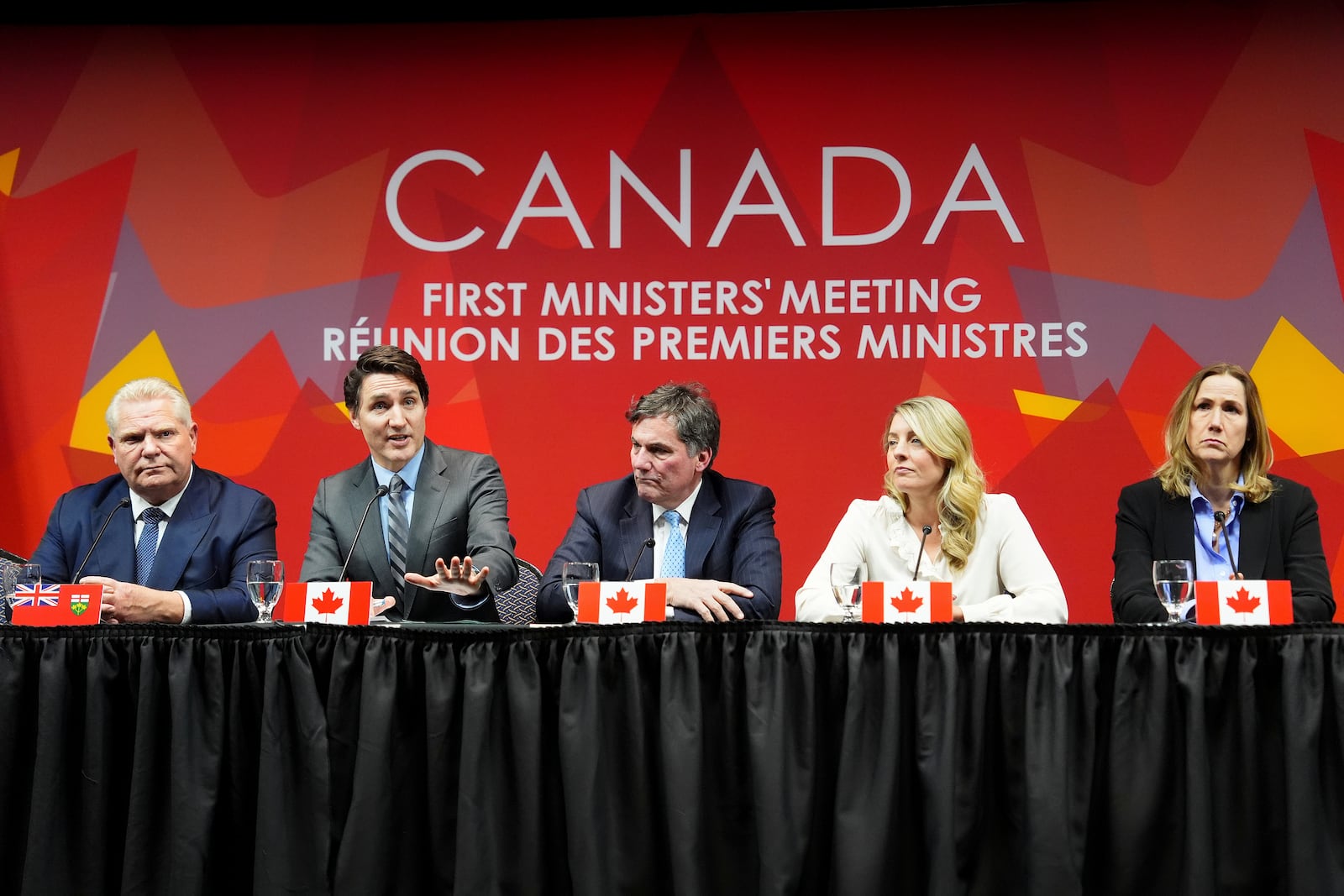 Canada's Prime Minister Justin Trudeau, second left, speaks as Ontario Premier Doug Ford, from left, Intergovernmental Affairs Minister Dominic Leblanc, Foreign Affairs Minister Melanie Joly and Ambassador of Canada to the U.S. Kirsten Hillman look on during a press conference to conclude a first ministers' meeting, in Ottawa, Ontario, Wednesday, Jan. 15, 2025. (Sean Kilpatrick/The Canadian Press via AP)