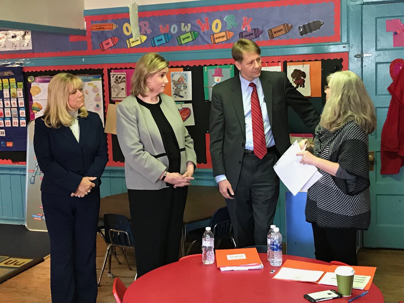 Democratic governor candidate Richard Cordray talks to Jama Hardern, owner/operator of Dayton’s Rainbow Years Child Care, about the process of becoming a five-star early childhood center in Ohio’s system. From left are Montgomery County Commissioner Debbie Lieberman and Dayton Mayor Nan Whaley. ERIC HIGGINBOTHAM / STAFF