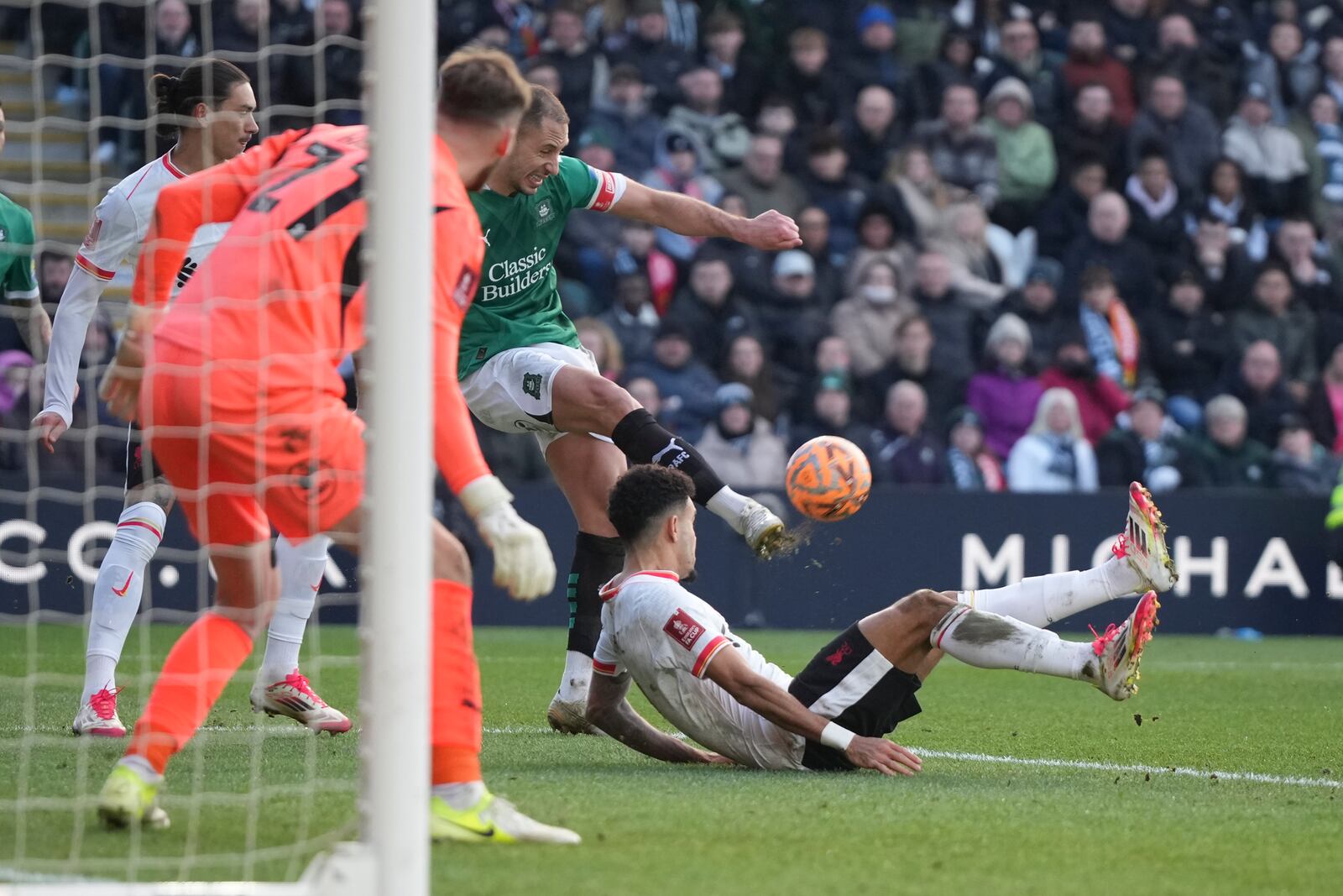 Liverpool's Luis Diaz falls during the English FA Cup fourth round soccer match between Plymouth Argyle and Liverpool at Home Park stadium in Plymouth, England, Sunday, Feb. 9, 2025. (AP Photo/Alastair Grant)