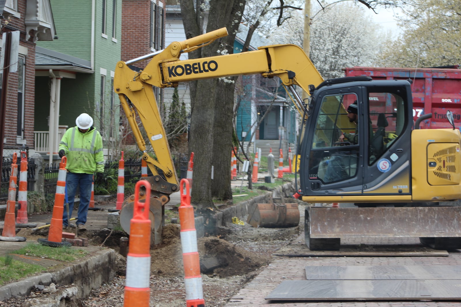 Crews work to install new water lines in Dayton's South Park neighborhood. CORNELIUS FROLIK / STAFF