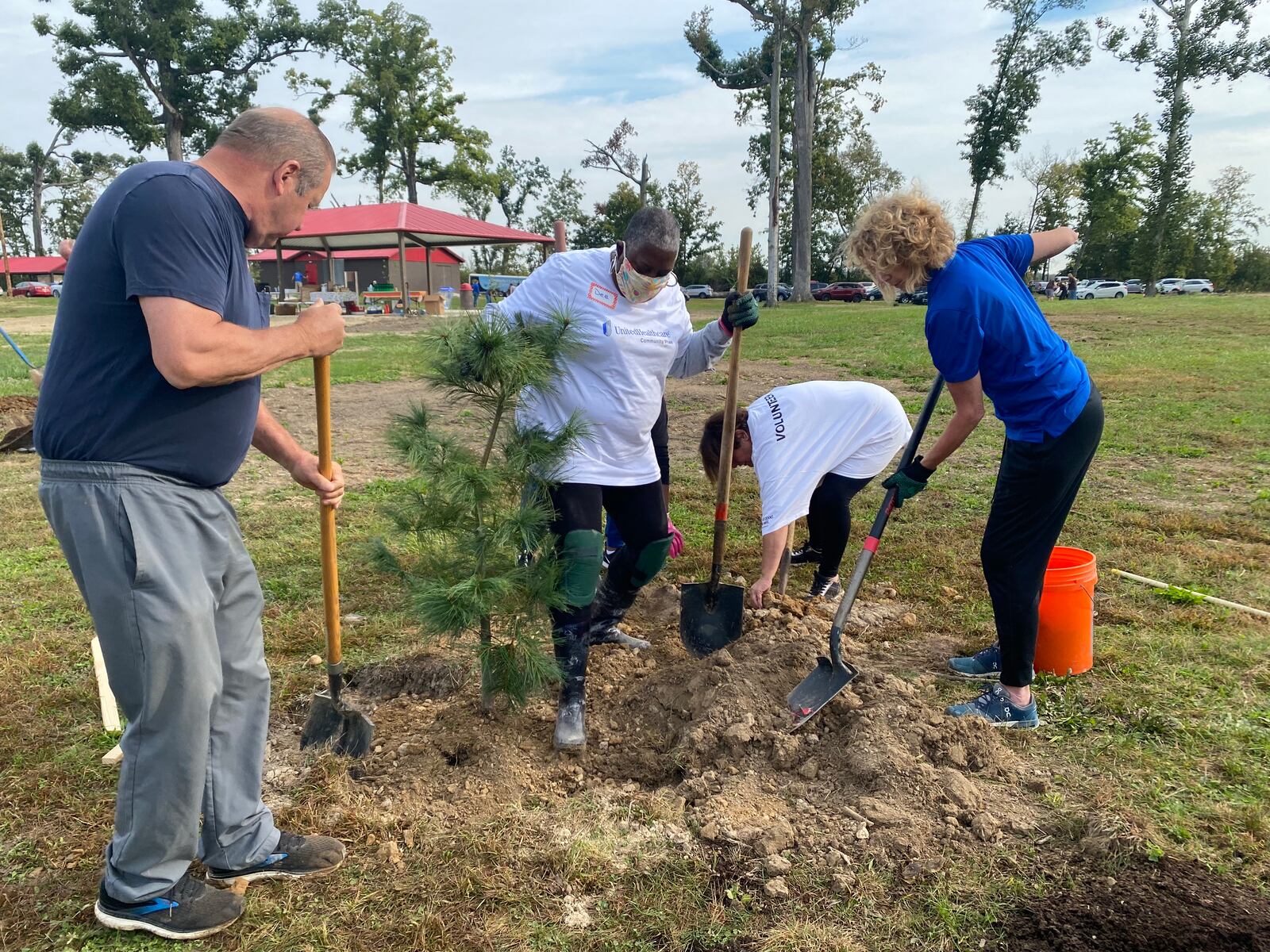 Volunteers from UnitedHealthcare plant a tree in Harrison Twp. on Saturday. The volunteers all came out to help plant 81 trees in Sinclair Park, which was damaged in the 2019 Memorial Day tornadoes. Eileen McClory / Staff