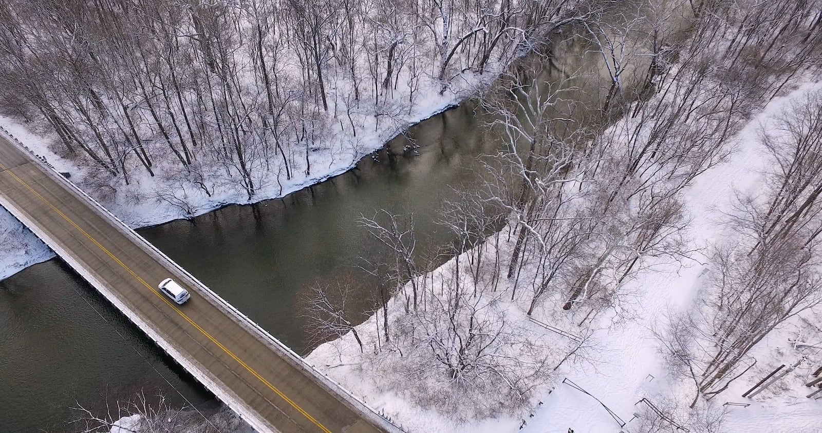 Indian Ripple Road crosses the Little Miami River in Beavercreek.  Snow fell across the Miami Valley from Sunday night into Monday night closing churches, schools and businesses into Tuesday.   TY GREENLEES / STAFF