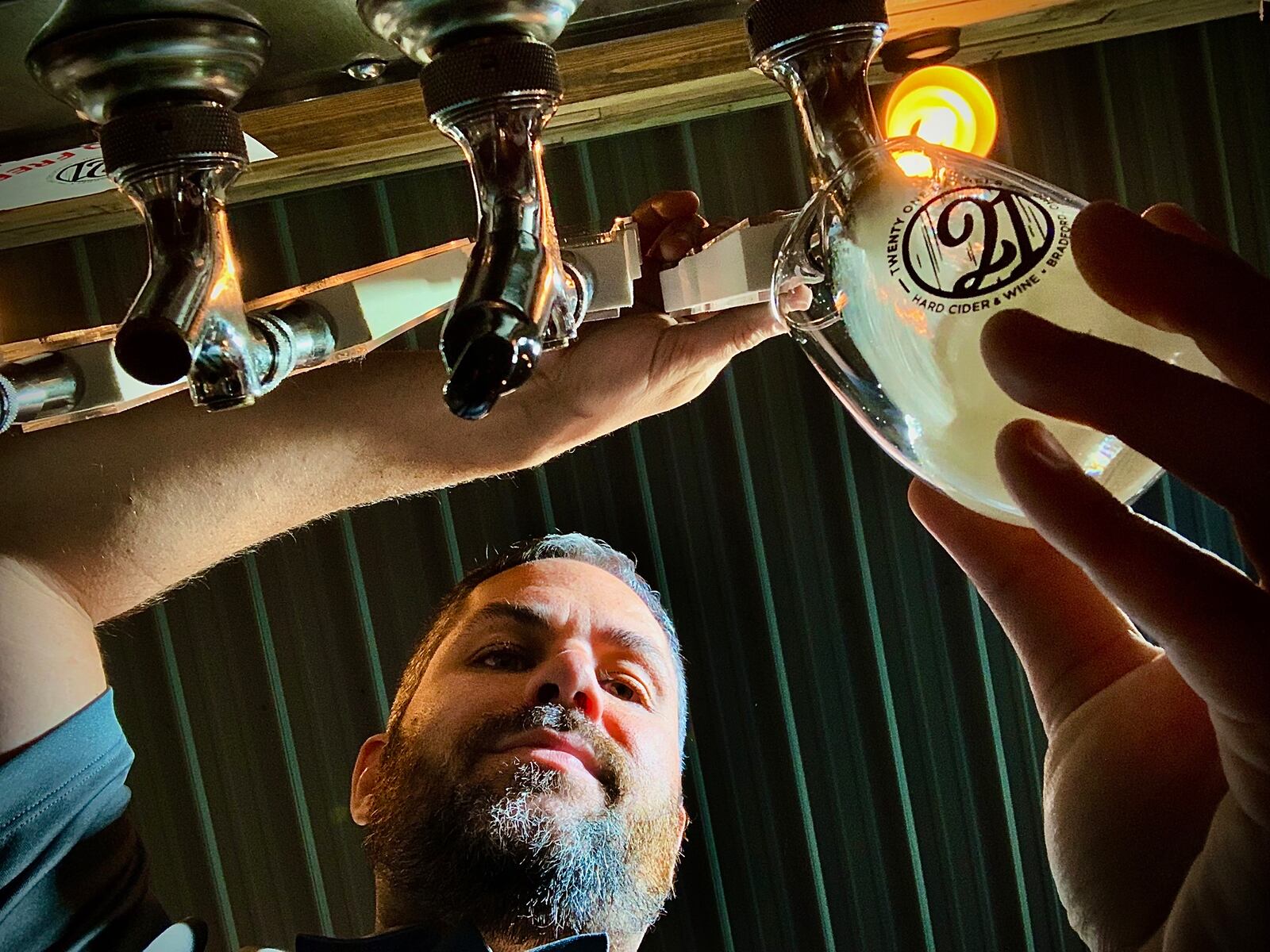 Shaun Pierce, Co-Founder of Twenty One Barrels Hard Cider & Wine in Bradford pours a hard cider. Twenty One Barrels Hard Cider & Wine won Best Patio Dining and Best Winery in the Best of Dayton contest. MARSHALL GORBY\STAFF