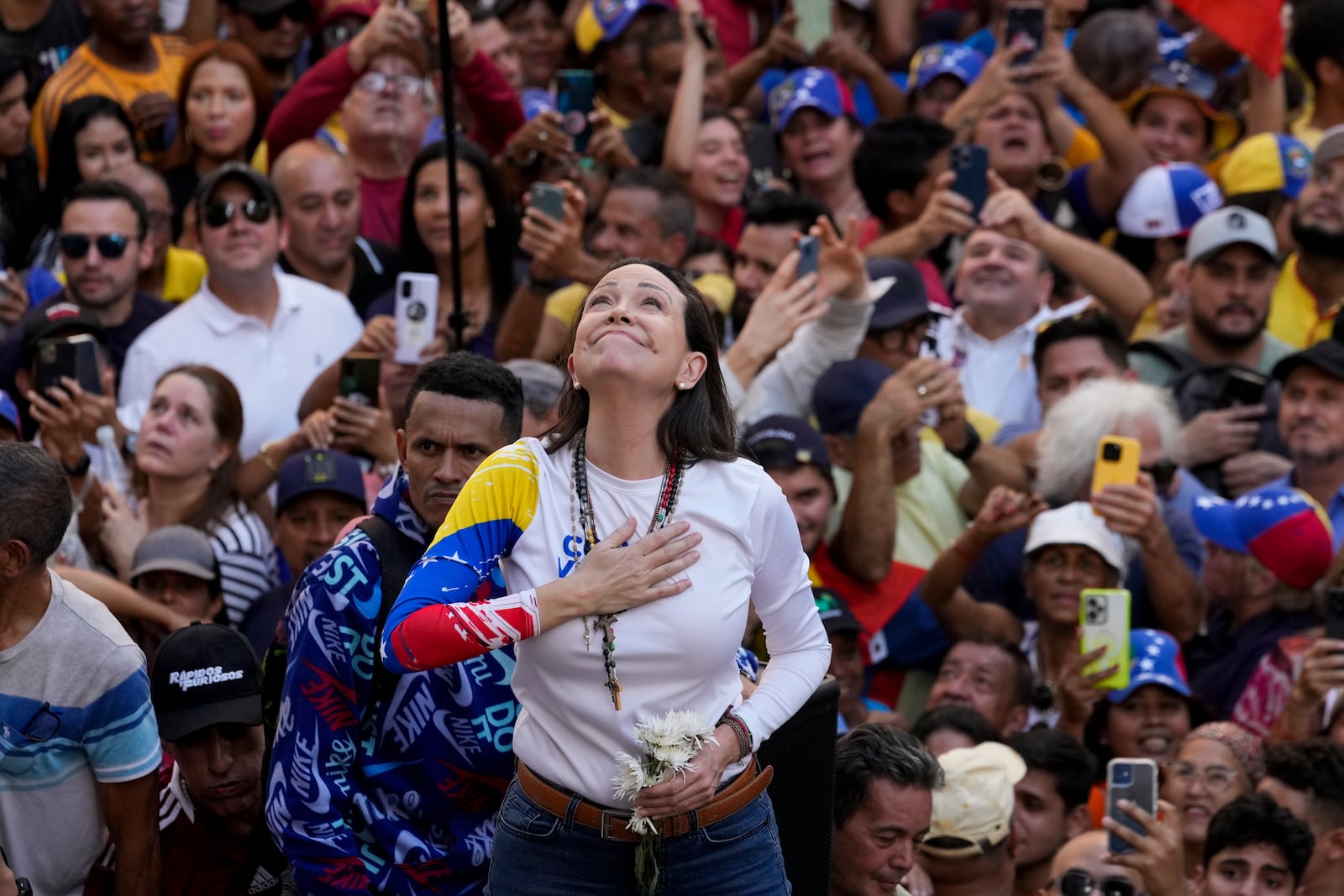 Venezuelan opposition leader Maria Corina Machado addresses supporters during a protest against President Nicolas Maduro the day before his inauguration for a third term, in Caracas, Venezuela, Thursday, Jan. 9, 2025. (AP Photo/Ariana Cubillos)