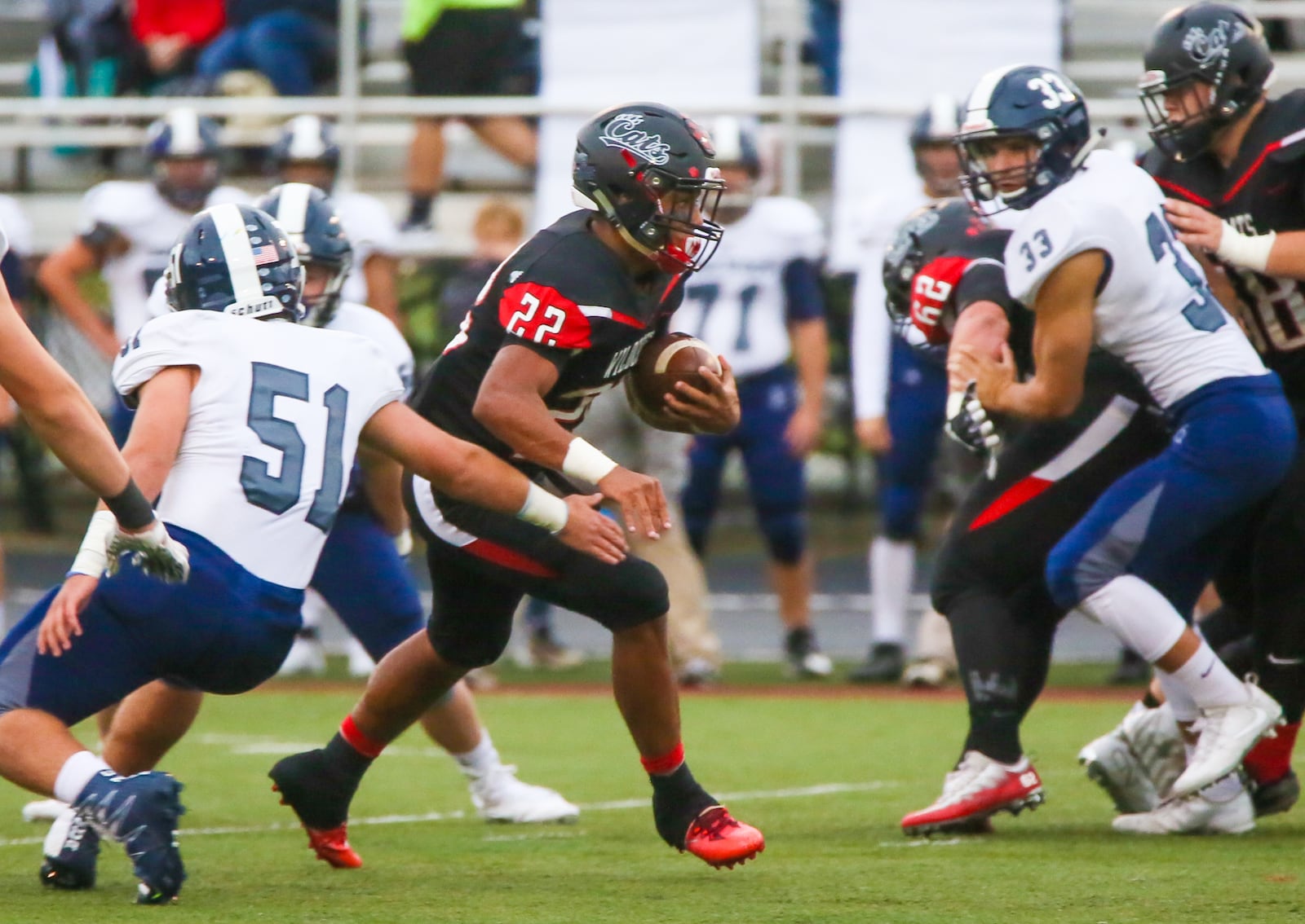 Franklin running back Ryan Montgomery (22) looks for room to run up the middle during their game against Edgewood, held at Atrium Stadium in Franklin Community Park, Friday, Sept. 1, 2017. GREG LYNCH / STAFF