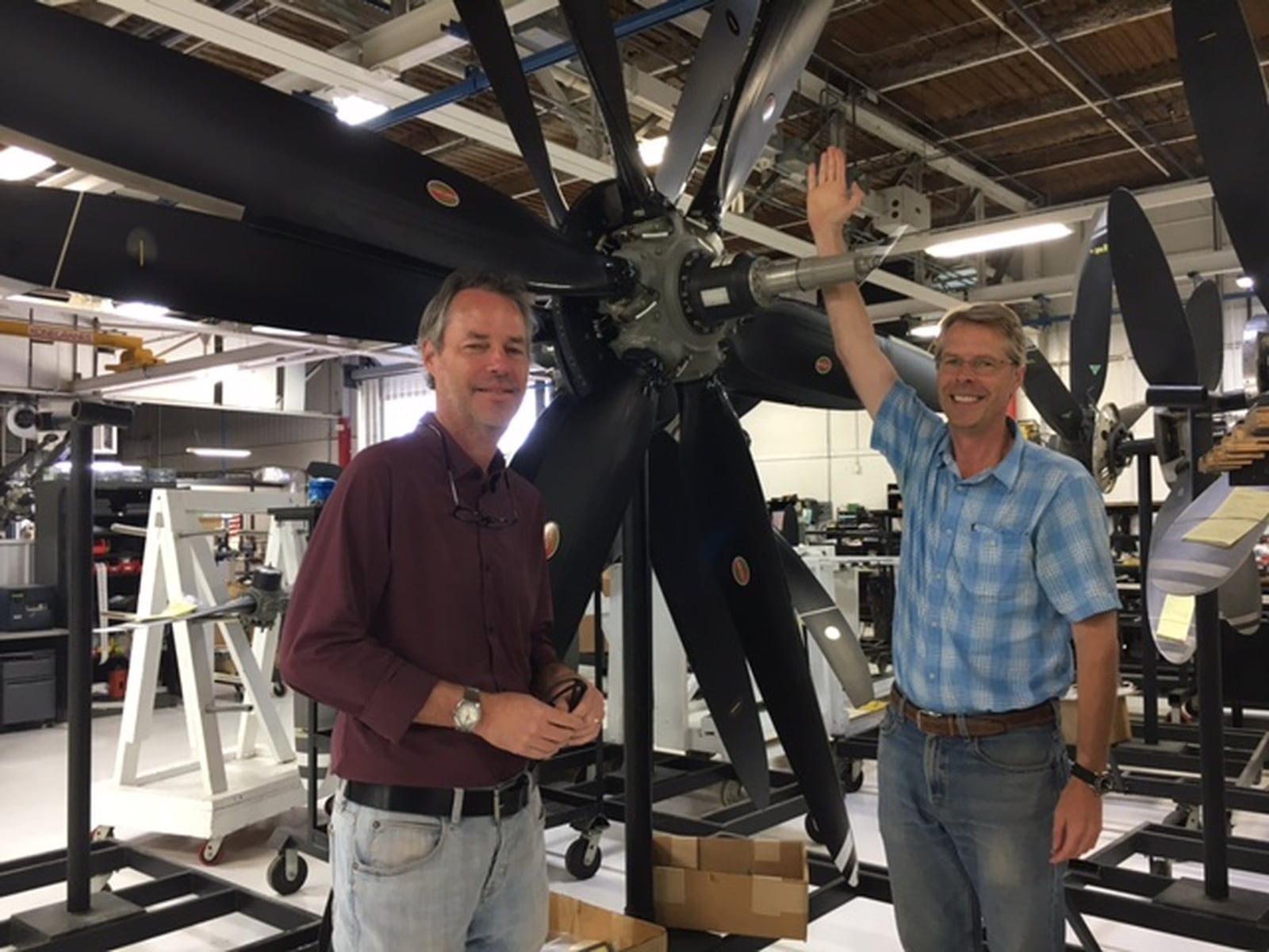 James Brown, left, Hartzell Propeller Inc., executive vice president, and Joseph Brown, Hartzell president, stand next to the largest propeller the Piqua company still maintains. THOMAS GNAU/STAFF