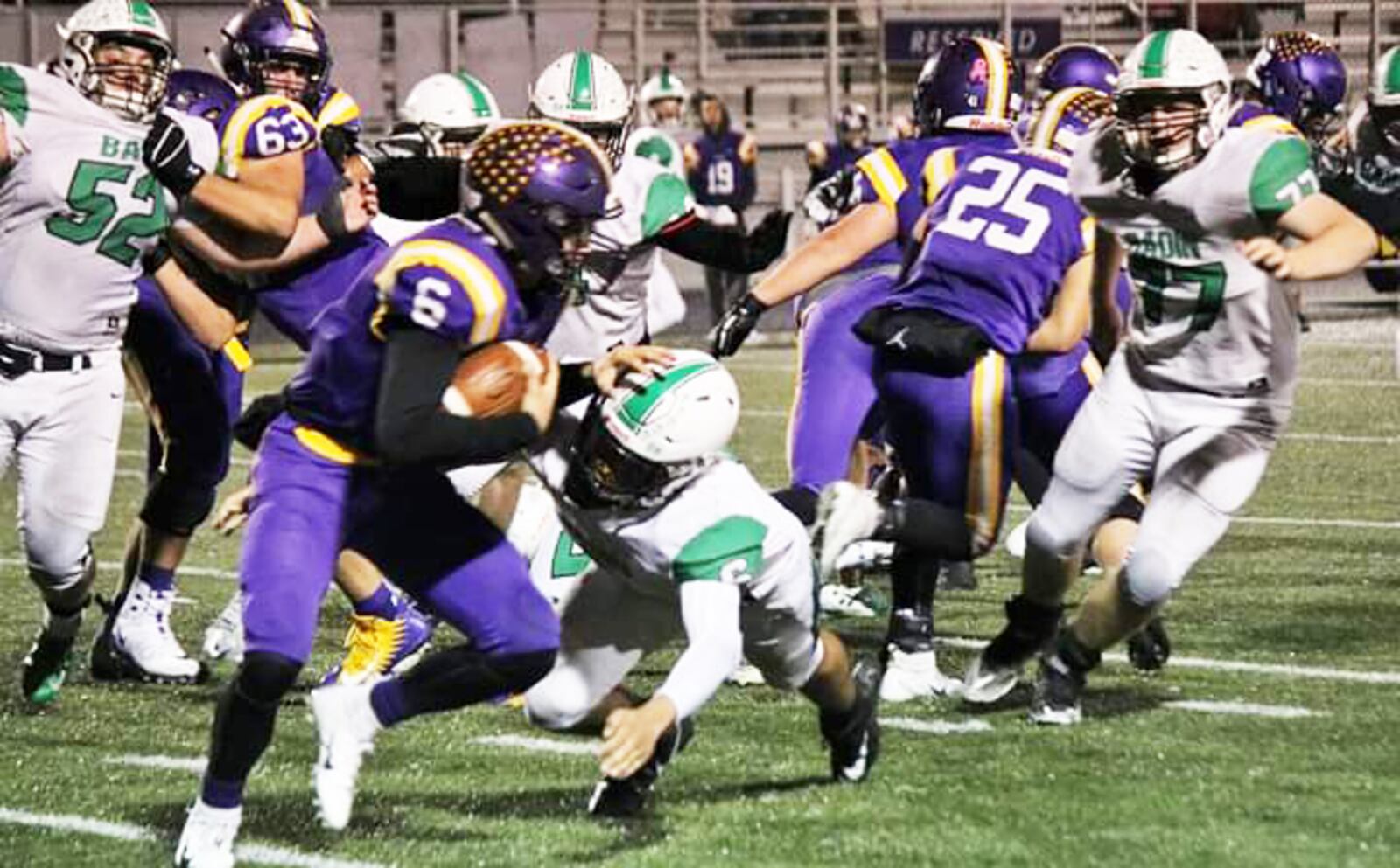 Badin's Jayden Carter tackles Vandalia Butler quarterback Mason Motter during last Friday's 33-22 win by the Rams in a Division III, Region 12 football playoff game at Memorial Field in Vandalia. CONTRIBUTED PHOTO BY TERRI ADAMS