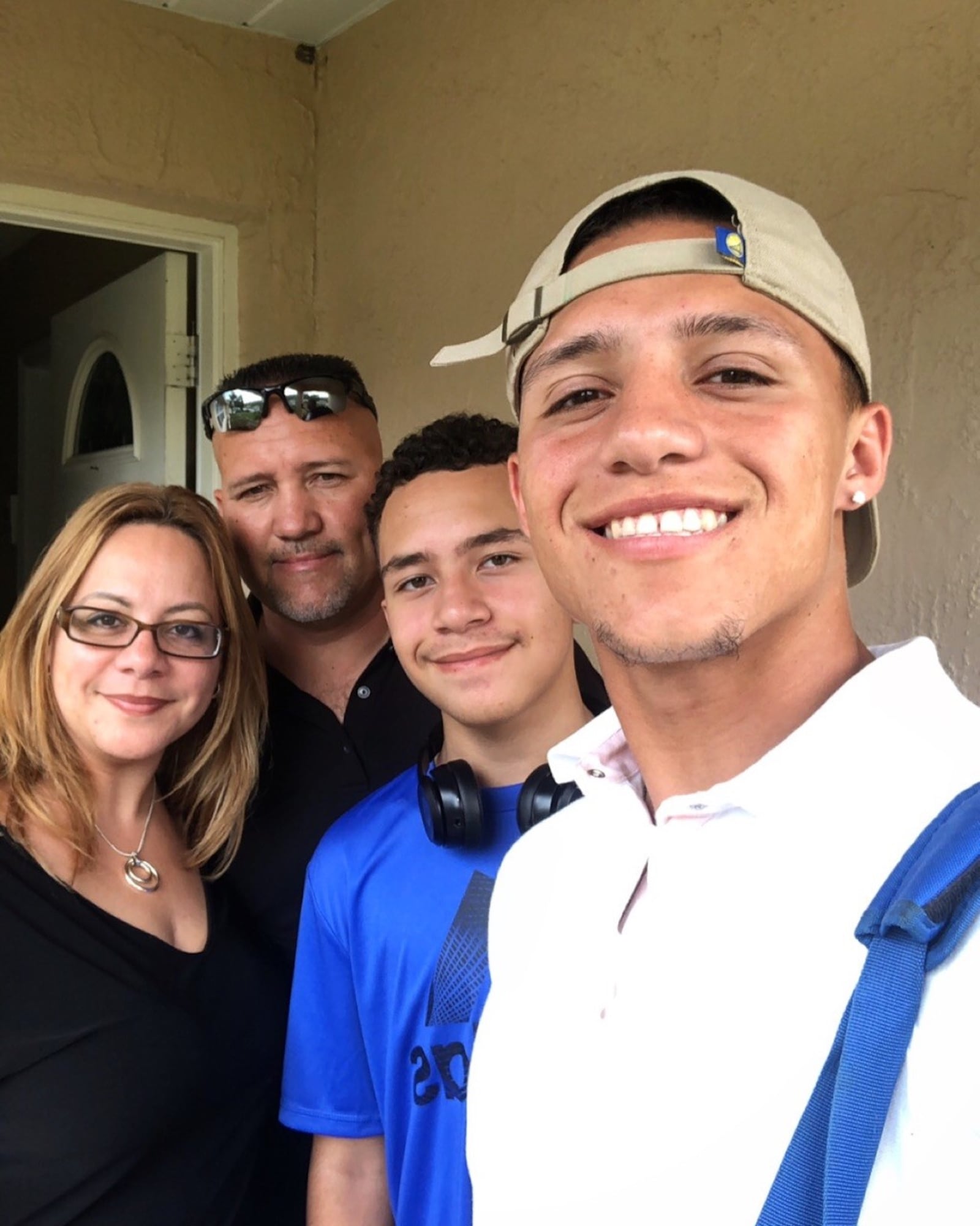 Dayton Dragons Brian Rey (far right), with his mother, Maritza Feliciano, father, Orlando Rey and hiis younger brother Brandon. CONTRIBUTED