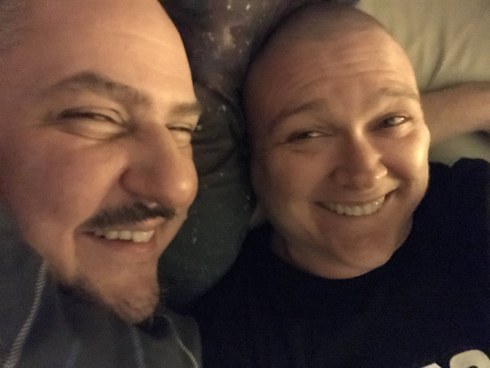 Kristen Wicker (right) shortly after going bald and her partner and primary caregiver, Matthew Leclaire, at home in Dayton. CONTRIBUTED