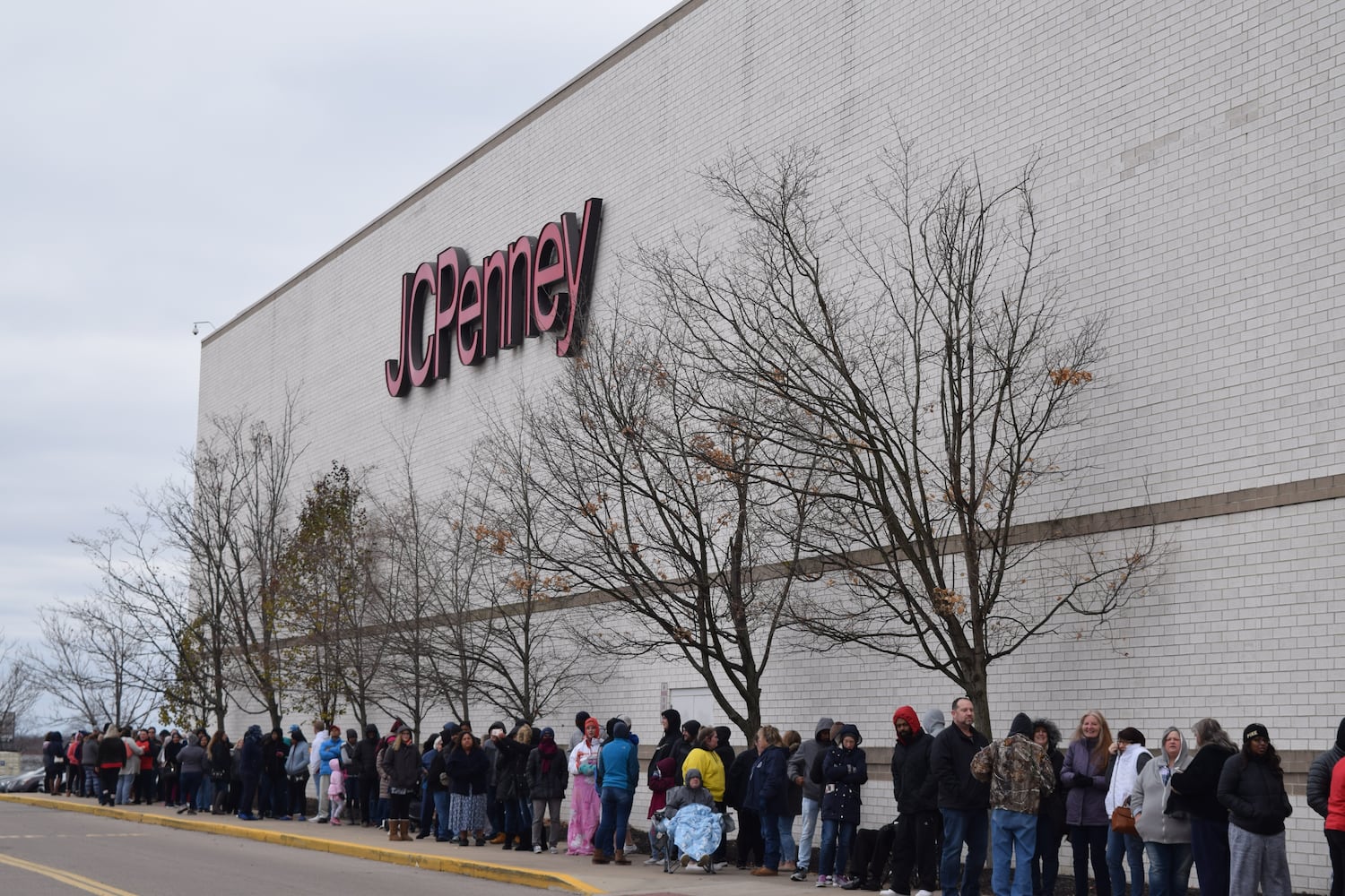 PHOTOS: Hundreds like up outside JCPenney for doorbusters, coupons