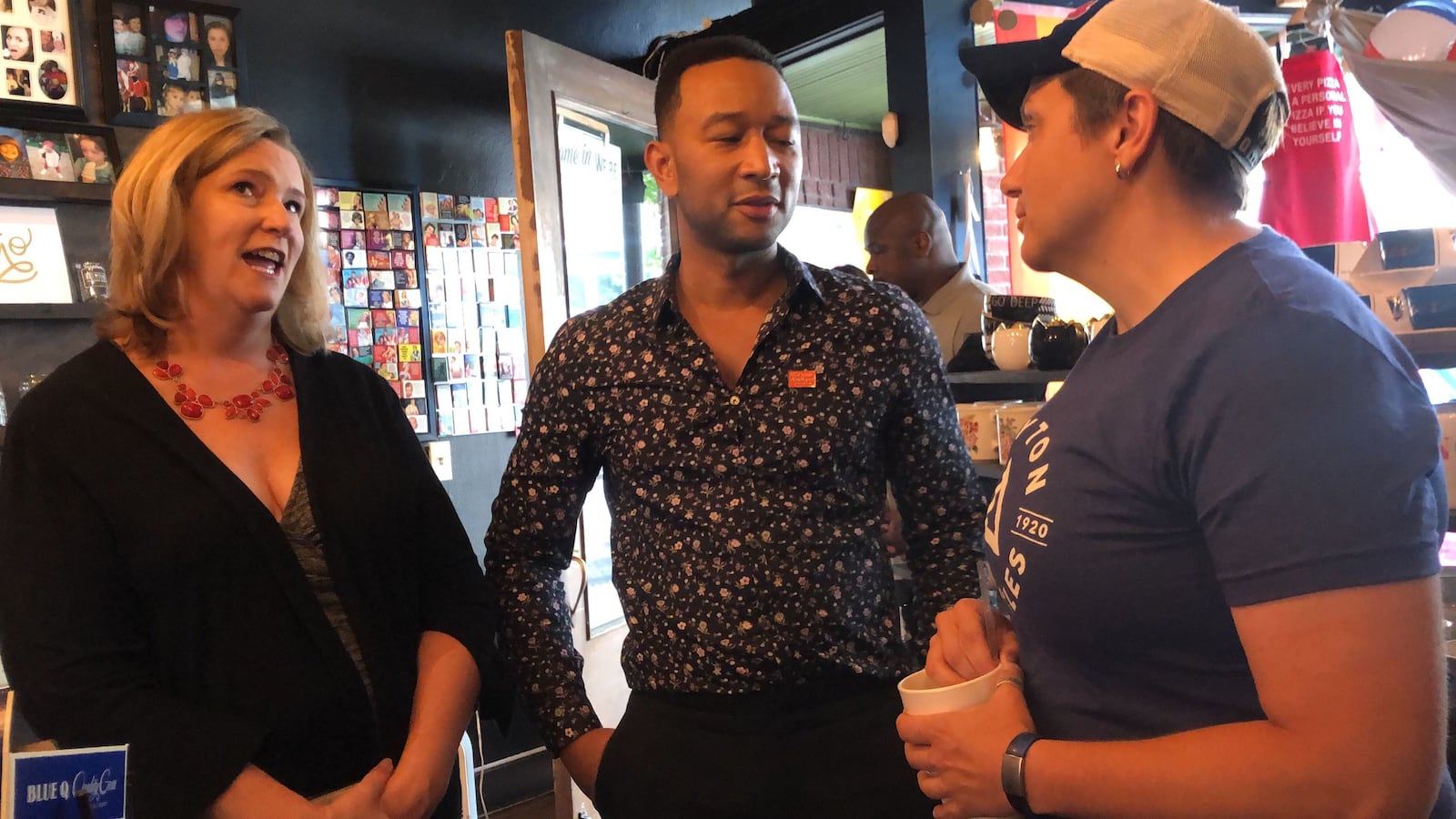 Dayton Mayor Nan Whaley (left) and Dayton Police Maj. Wendy Stiver (right) talk with Springfield native and entertainer John Legend inside Heart Mercantile in Dayton's Oregon District on Aug. 11, 2019. AMELIA ROBINSON/STAFF