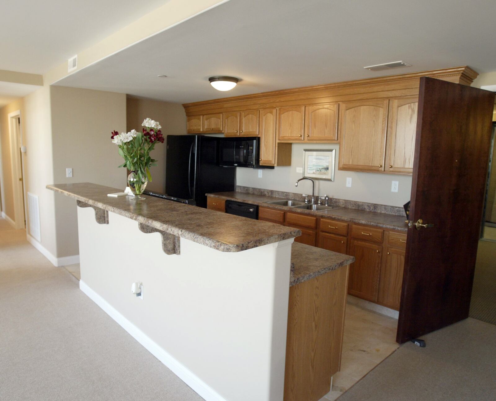 The kitchen area in one of the luxury apartments at First Place. Photo by Ed Roberts