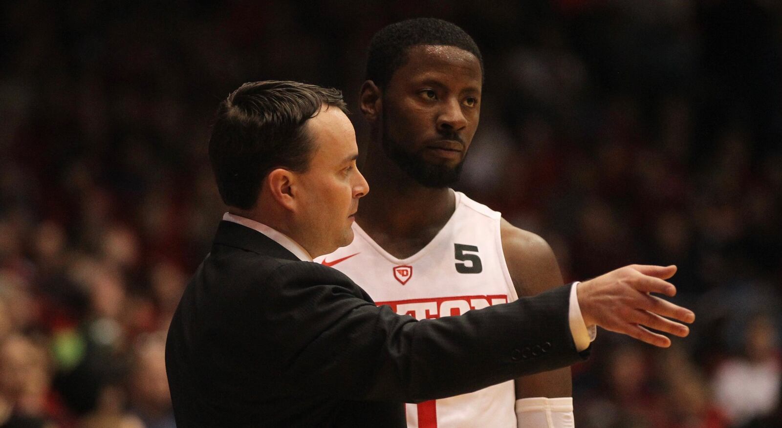 Dayton’s Archie Miller talks to Scoochie Smith during a game against Saint Mary’s on Saturday, Nov. 19, 2016, at UD Arena. David Jablonski/Staff