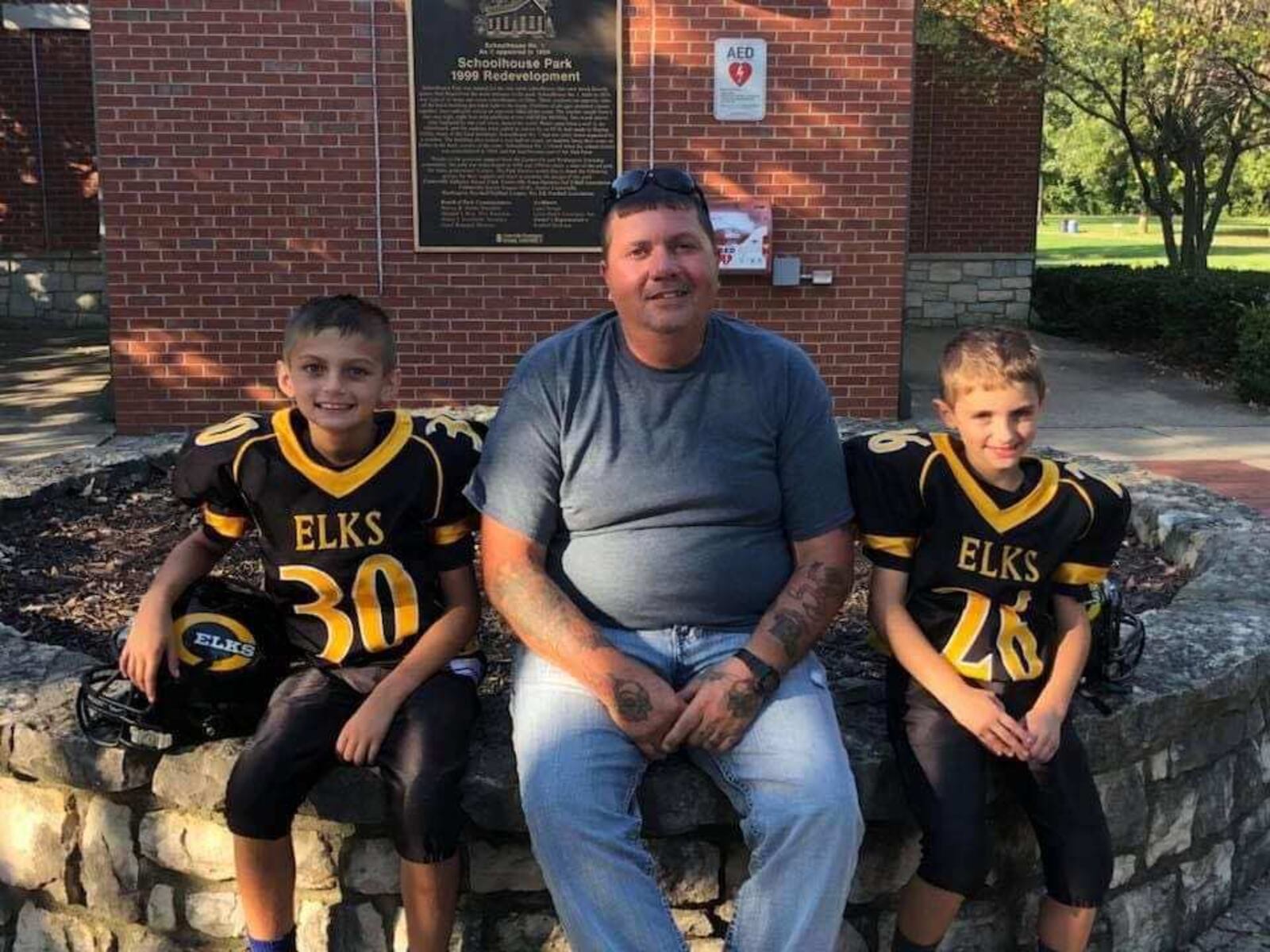 Timothy Tufano, who was killed in a crash Monday while picking up litter on the side of the highway, is shown with his grandsons, Jayce and Hayden. / CONTRIBUTED