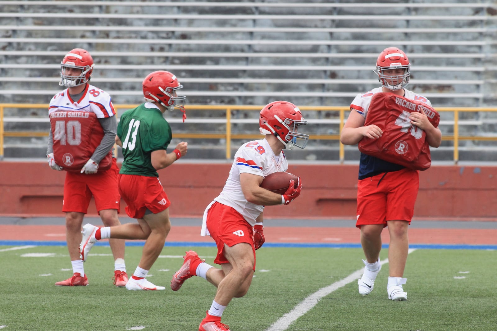 Dayton's Jake Chisholm runs the ball at the first practice of the season on Monday, Aug. 9, 2021, in Dayton. David Jablonski/Staff