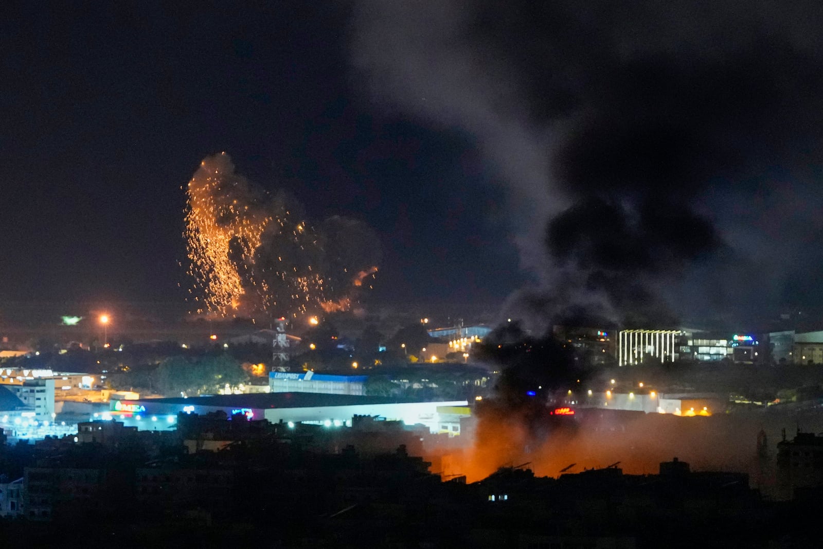 Smoke and fire rise from Israeli airstrikes in Dahiyeh, Beirut, Lebanon, Lebanon, Thursday, Nov. 7, 2024. (AP Photo/Hassan Ammar)