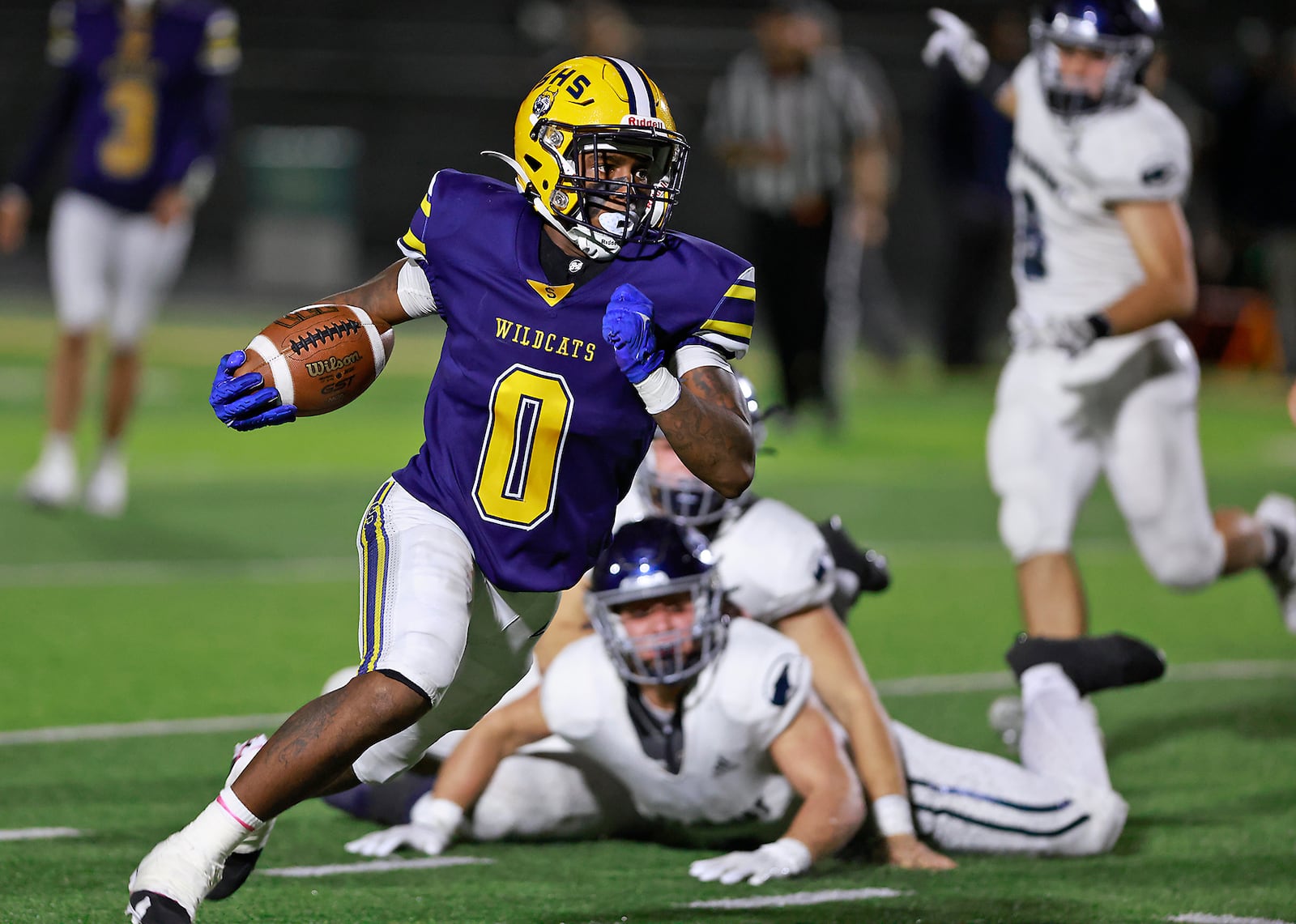 Springfield's Deontre Long carries the ball against Fairmont.  BILL LACKEY/STAFF