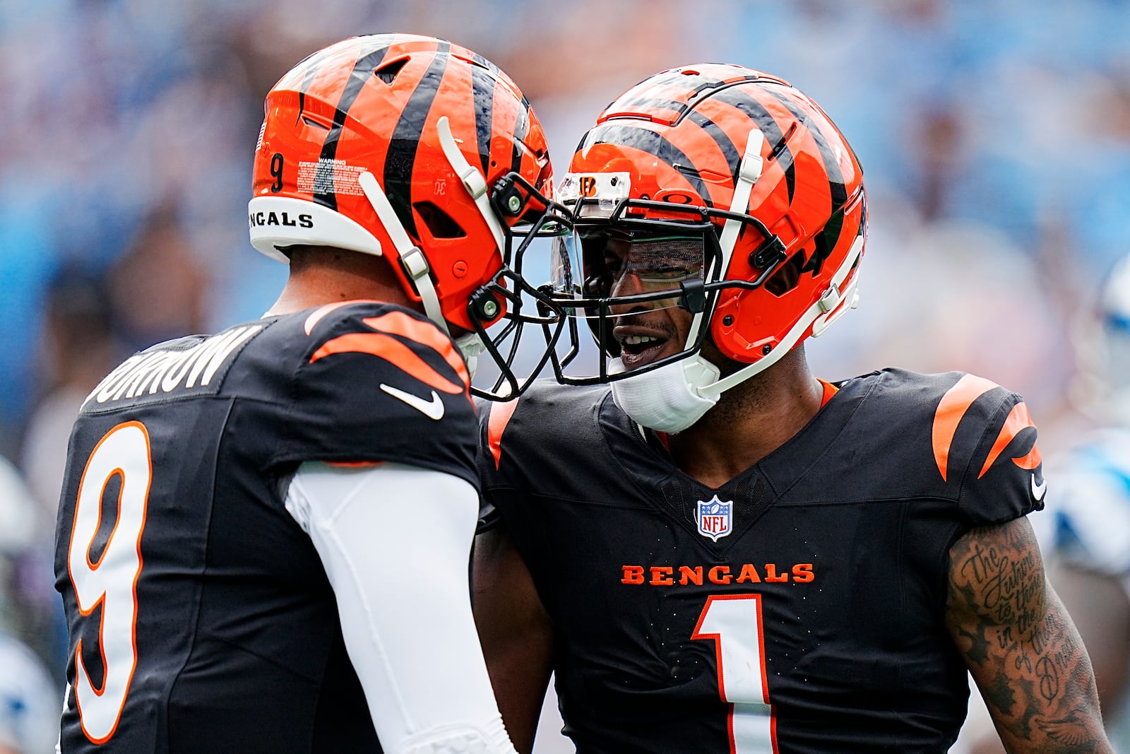 Cincinnati Bengals wide receiver Ja'Marr Chase celebrates after scoring with quarterback Joe Burrow against the Carolina Panthers during the first half of an NFL football game, Sunday, Sept. 29, 2024, in Charlotte, N.C. (AP Photo/Rusty Jones)