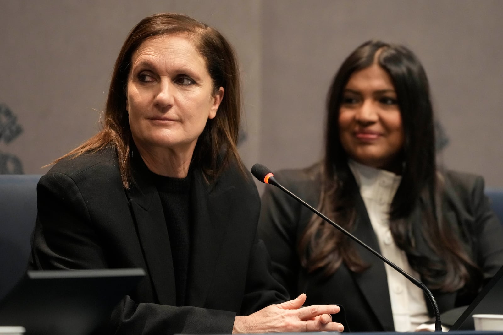 Dior Artistic Director Maria Grazia Chiuri, left, and Creative director, Chanakya International Karishma Swali attend a press conference presenting the exhibition "En Route" organized by the Vatican Apostolic Library exploring world tours of the late 19th century at the Vatican, Friday, Jan. 31, 2025. (AP Photo/Gregorio Borgia)