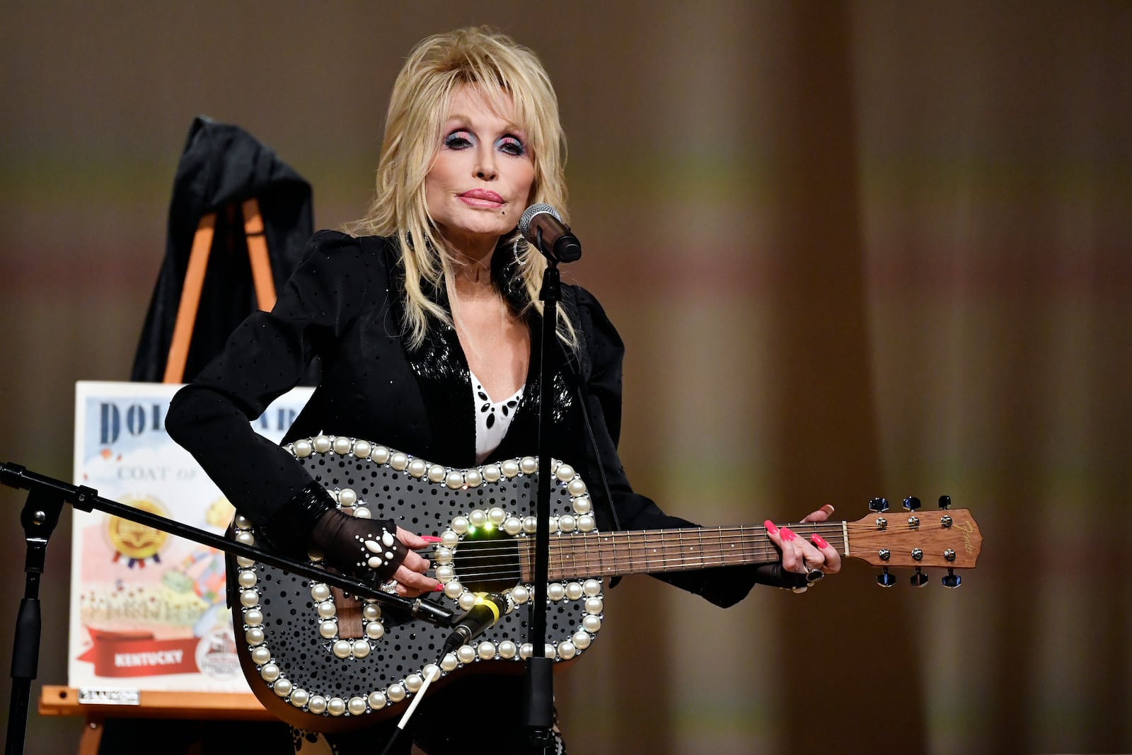 FILE - Dolly Parton appears at an event to celebrate the expansion of the Imagination Library of Kentucky at the Lyric Theatre in Lexington, Ky., on Aug. 27, 2024. (AP Photo/Timothy D. Easley, File)