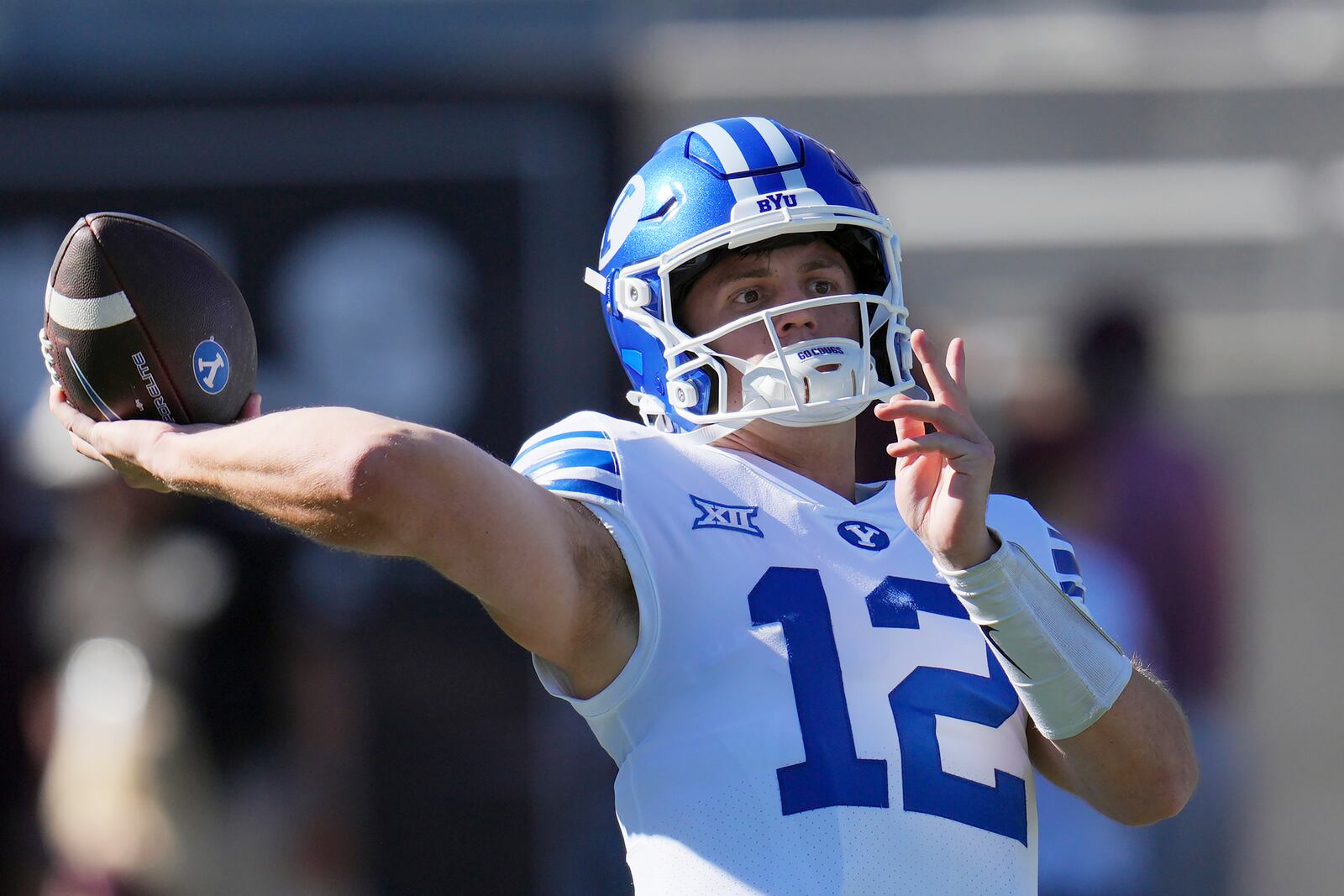 BYU quarterback Jake Retzlaff warms up prior to an NCAA college football game against Arizona State, Saturday, Nov. 23, 2024, in Tempe, Ariz. (AP Photo/Ross D. Franklin)