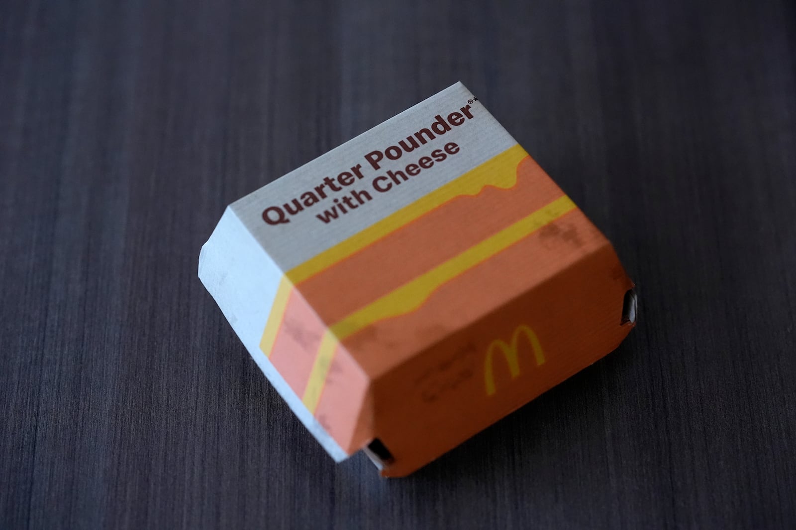 Pictured is a McDonald's Quarter Pounder sandwich box purchased Wednesday, Oct. 23, 2024, in Chicago. (AP Photo/Charles Rex Arbogast)