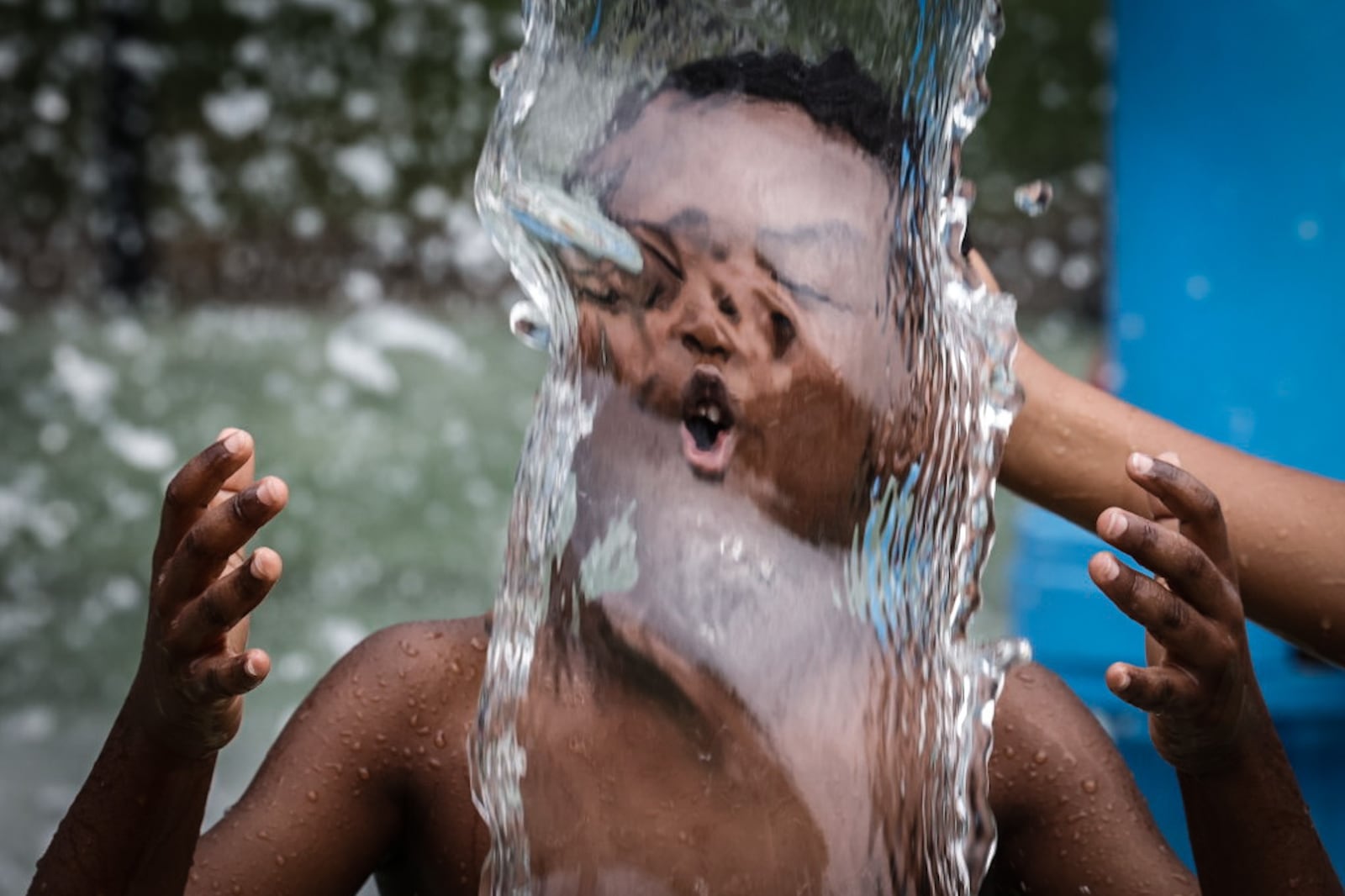 Kids and adults enjoyed the splash pad at Island MetroPark Tuesday June 18, 2024. This week the Dayton area is expecting near100 degree temperatures all week. JIM NOELKER/STAFF