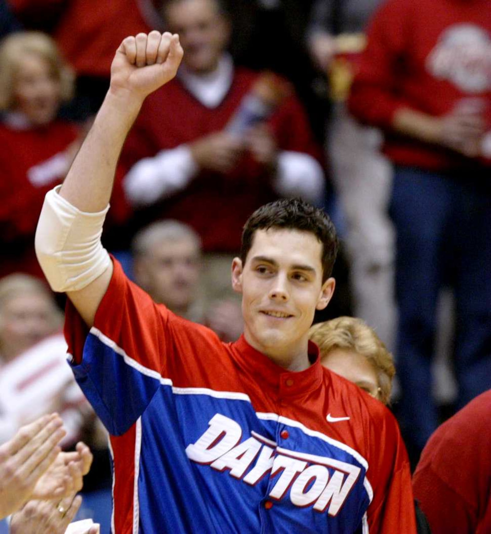 Dayton's Keith Waleskowski acknowledges the fans as the seniors are honored prior to the game against Rhode Island in 2004. Dayton Daily News photo by Ron Alvey