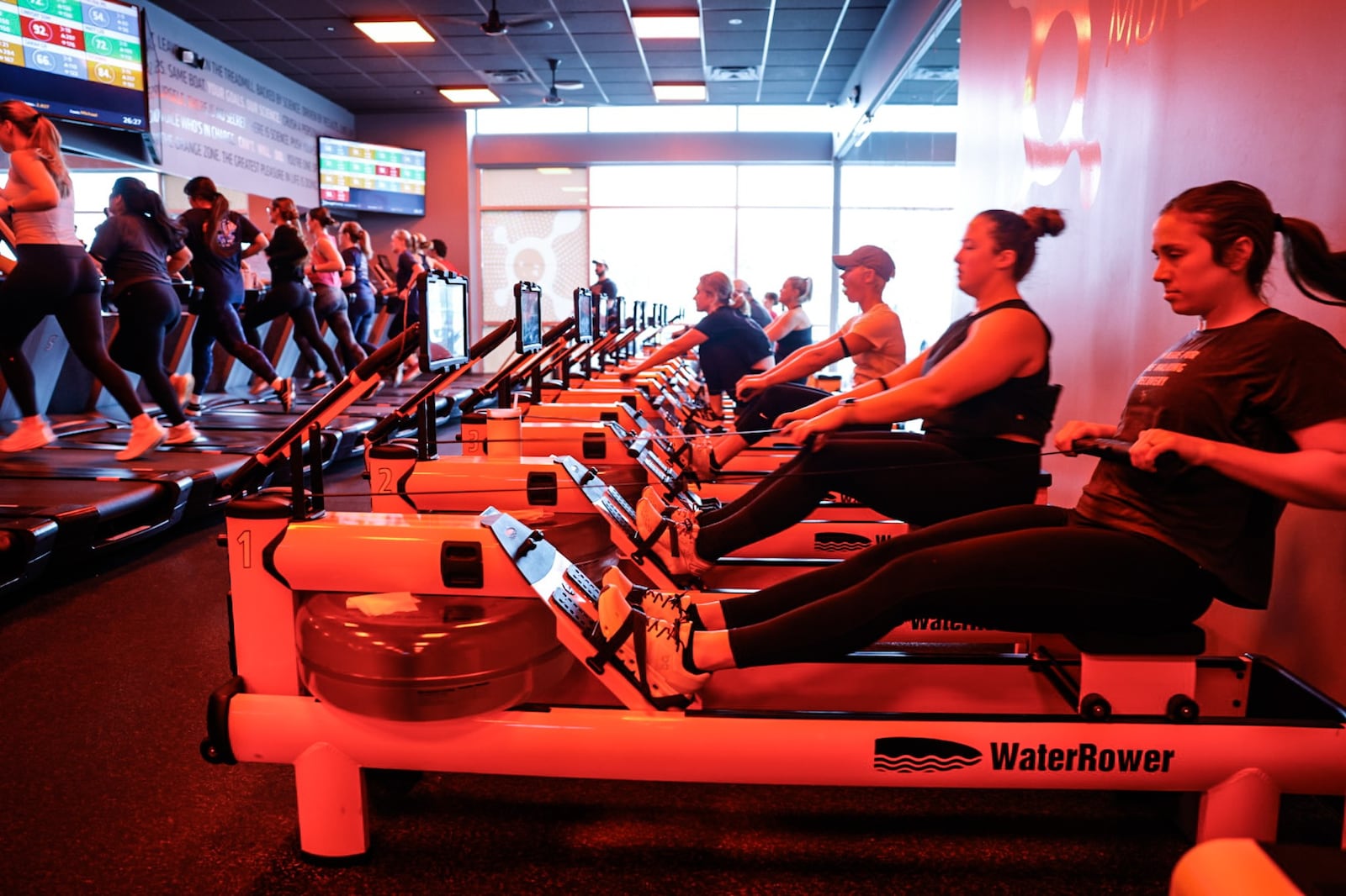 Fitness enthusiasts workout on rowing machines at Orangetheory Fitness in Beavercreek on Thursday morning, Dec. 28, 2023. JIM NOELKER/STAFF