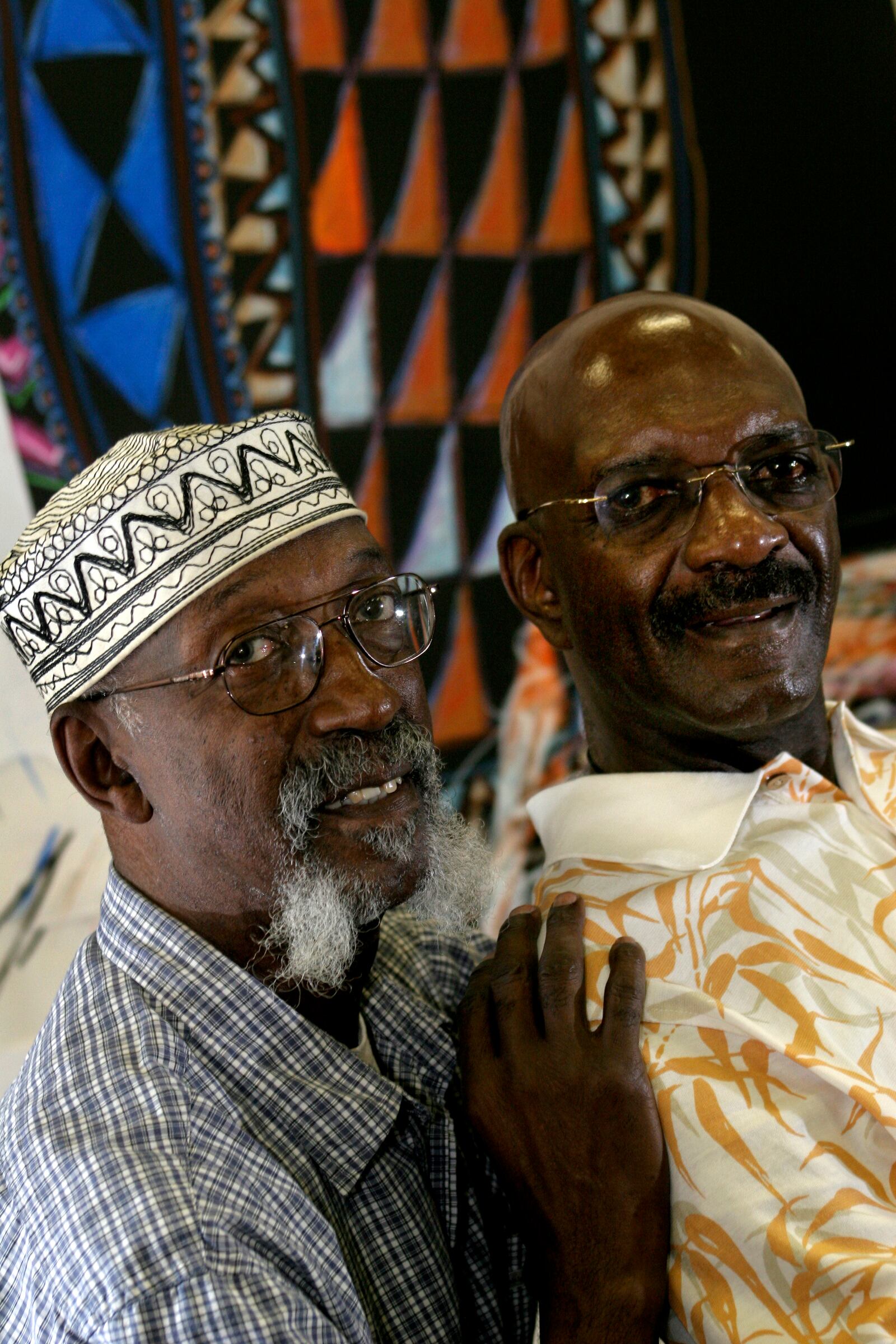 Bing Davis (left) and his brother John Joseph Davis (right) at Ebonnia Gallery in Dayton in 2005. FILE PHOTO