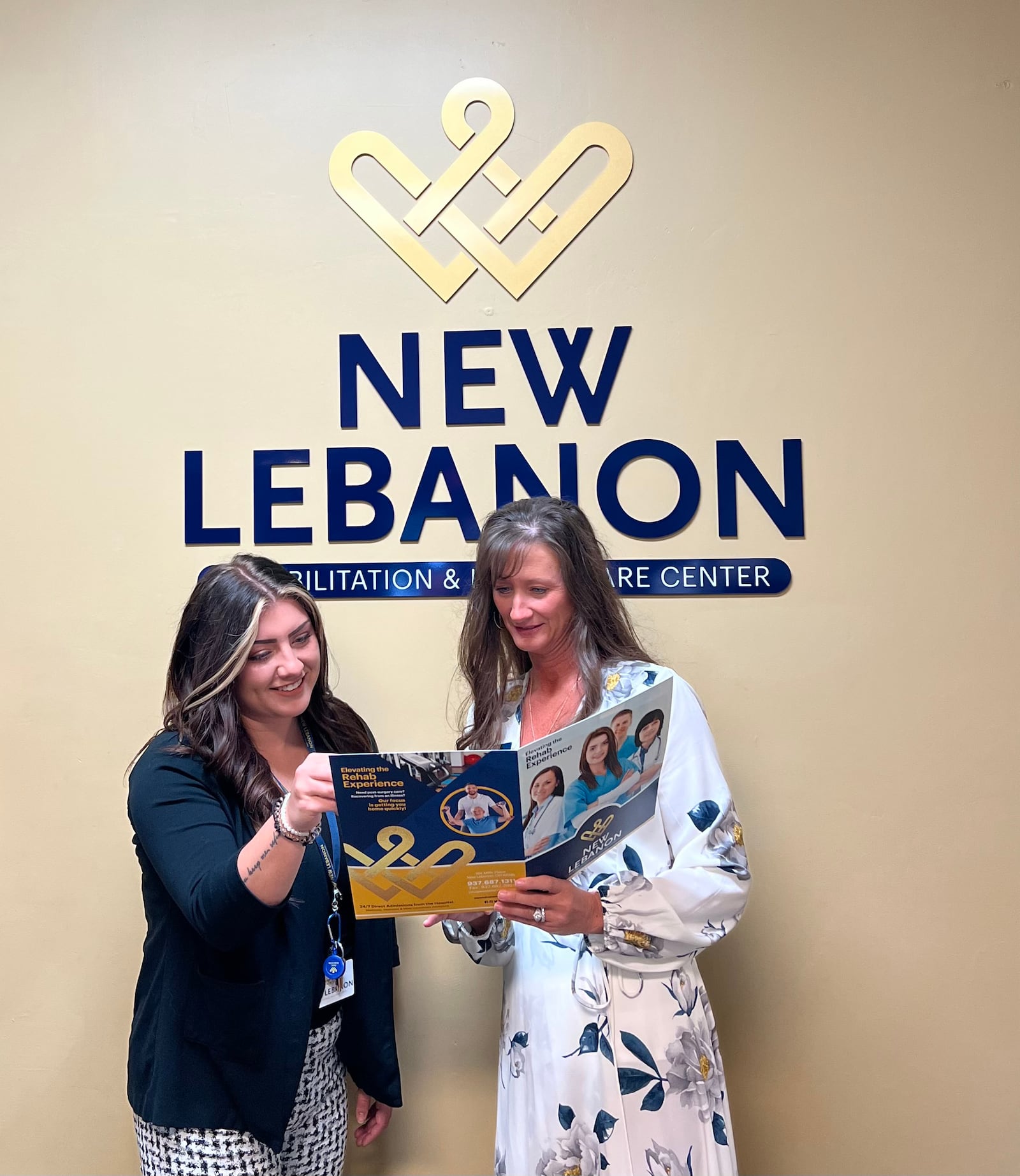 Danielle Feltner (right) talks with the New Lebanon Rehabilitation and HealthCare Center Human Resources Director Paige Baker during National Long-Term Care Administrators Week in mid-March.