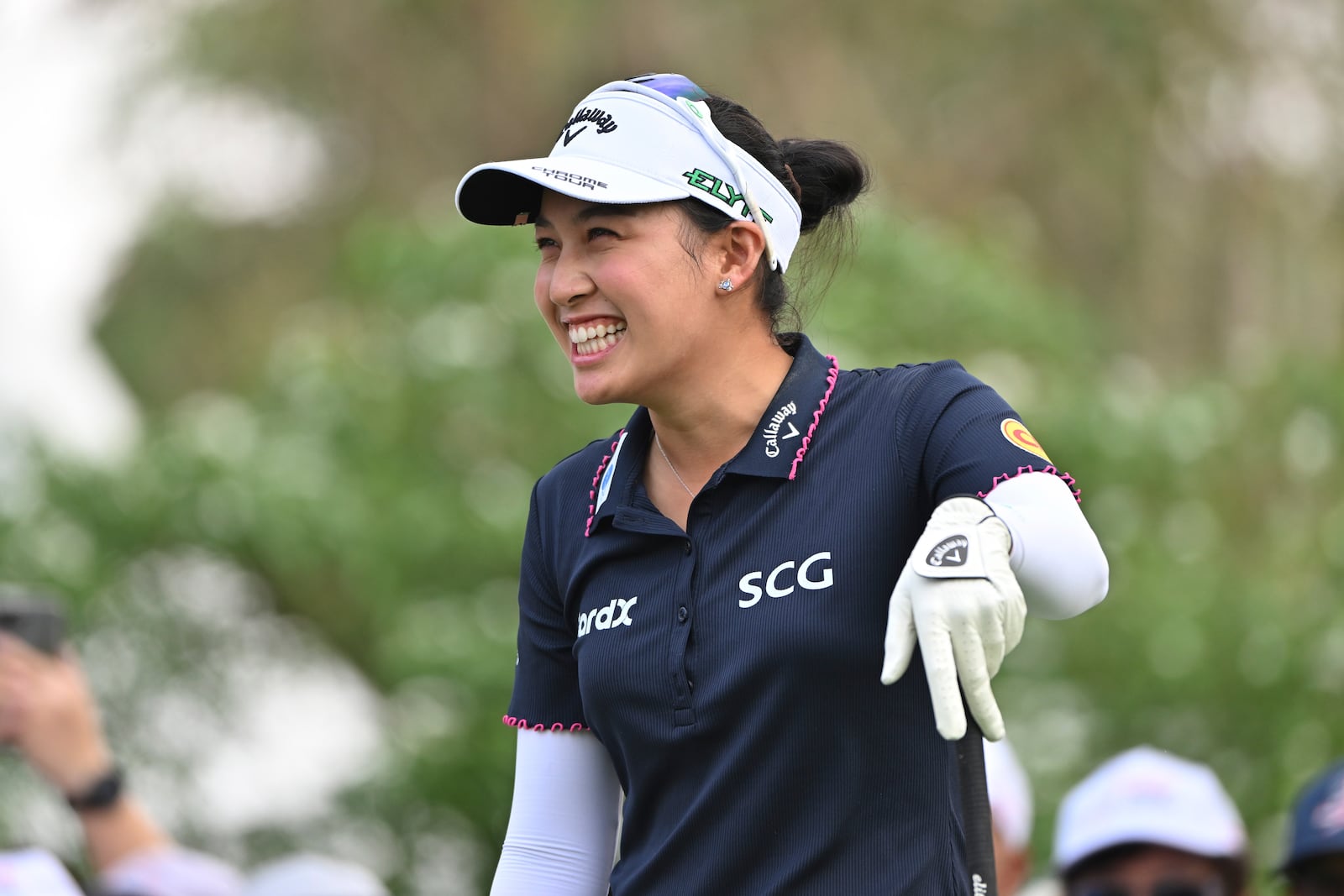 Atthaya Thitikul of Thailand reacts after playing on the 1st hole during the first round of the LPGA Honda Thailand golf tournament in Pattaya, southern Thailand, Thursday, Feb. 20, 2025. (AP Photo/Kittinun Rodsupan)