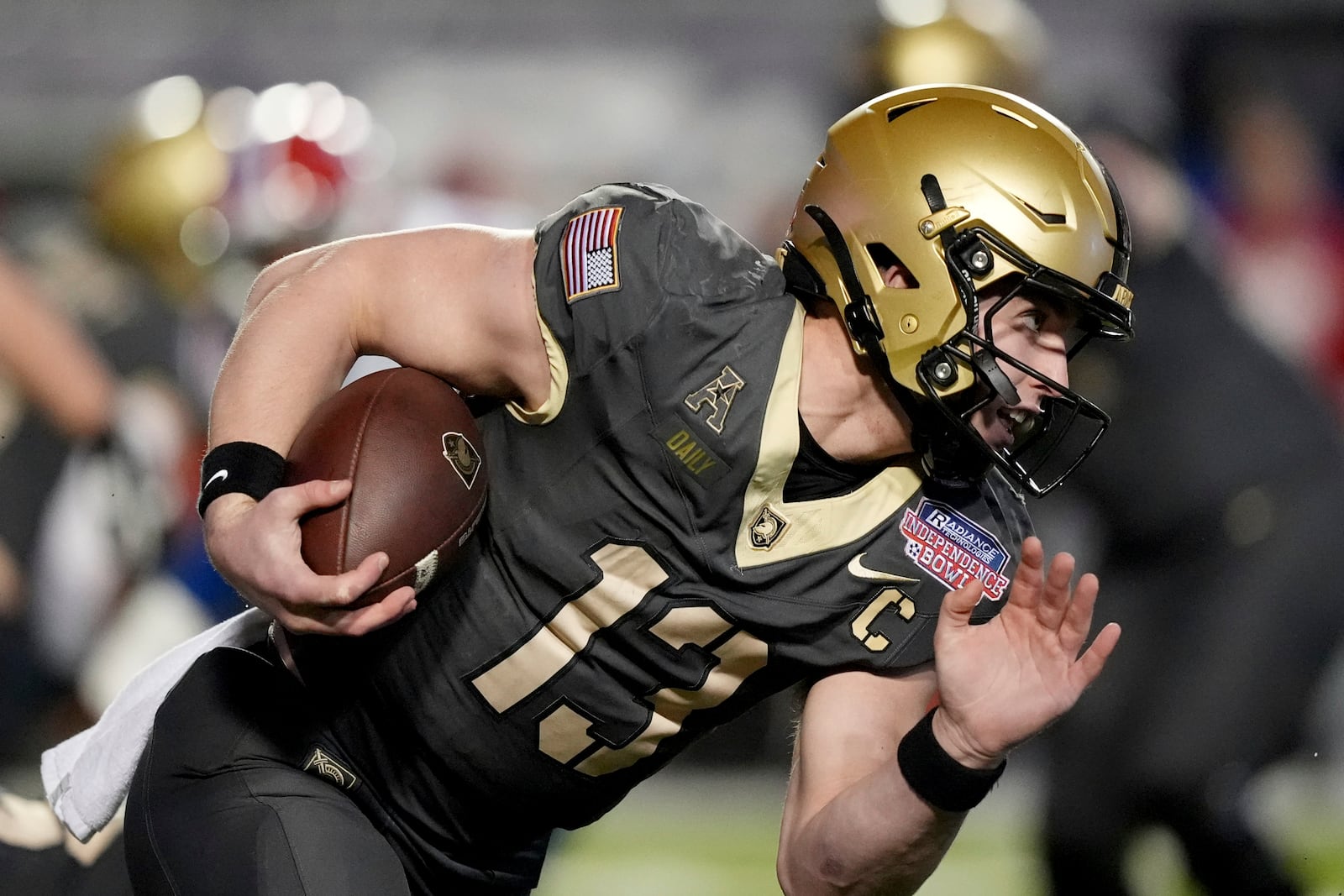 Army quarterback Bryson Daily (13) runs for a first down against Louisiana Tech during the first half of the Independence Bowl NCAA college football game, Saturday, Dec. 28, 2024, in Shreveport, La. (AP Photo/Rogelio V. Solis)