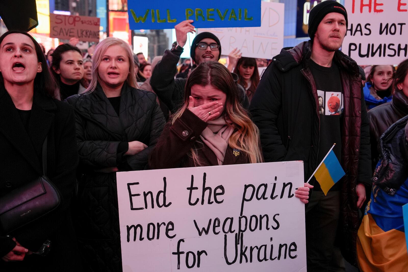 A woman wipes away tears during a rally in Times Square on the three-year anniversary of Russia's invasion of Ukraine, Monday, Feb. 24, 2025, in New York. (AP Photo/Julia Demaree Nikhinson)