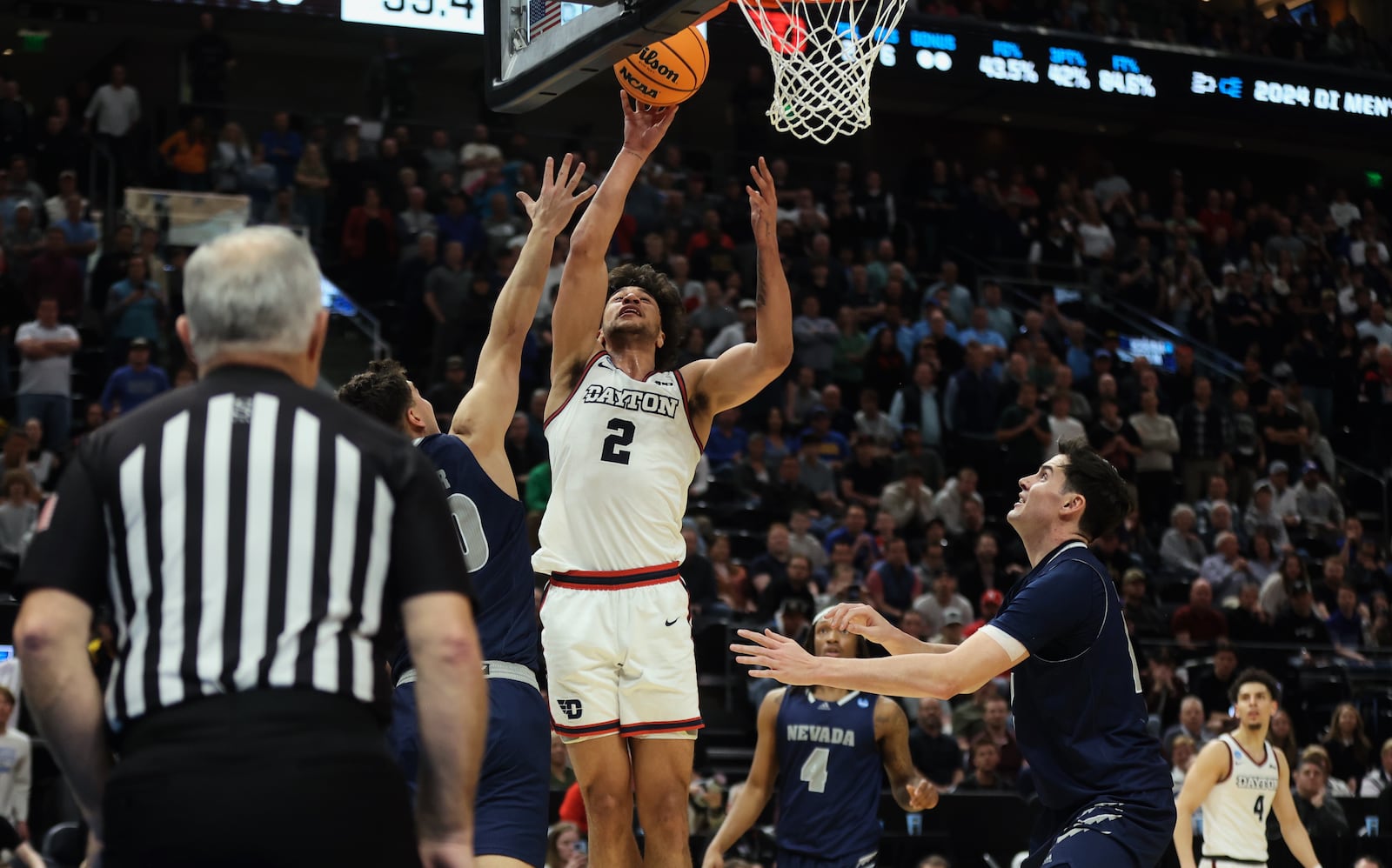 Dayton's Nate Santos scores the go-ahead basket in the final minute against Nevada in the first round of the NCAA tournament on Thursday, March 21, 2024, at the Delta Center in Salt Lake City, Utah. David Jablonski/Staff