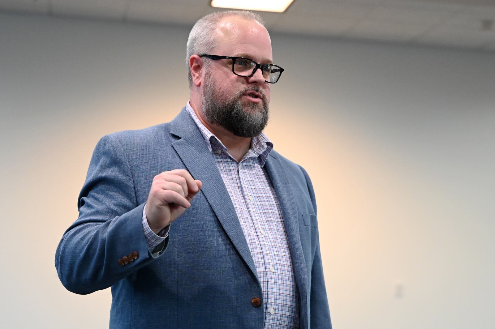 First Financial Bank Senior Business Specialist and Consultant Dewayne  Greenwood talks on Tuesday, Jan. 28, 2025, about the improvements being made at the bank's downtown Hamilton building and its support for having Amtrak bring passenger rail through Hamilton. MICHAEL D. PITMAN/STAFF