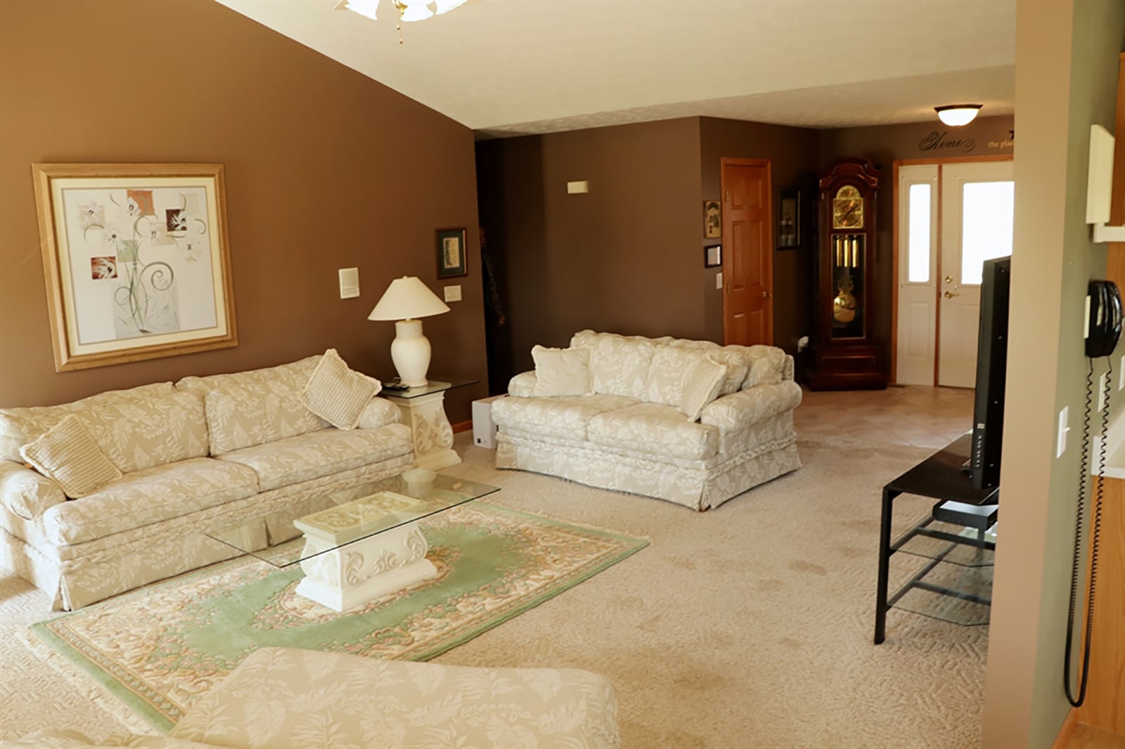 Formal entry opens from a covered front-door nook into a great room with a cathedral ceiling. CONTRIBUTED PHOTO BY KATHY TYLER