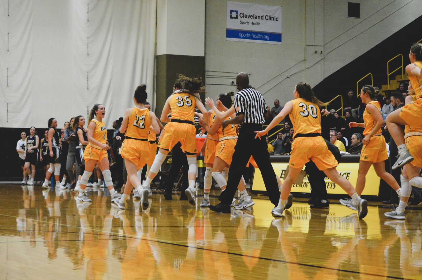 Springboro native Kasey Hughes of the Baldwin-Wallace women’s basketball team is mobbed by teammates during Wednesday’s game vs. John Carroll. Hailey Owens/CONTRIBUTED