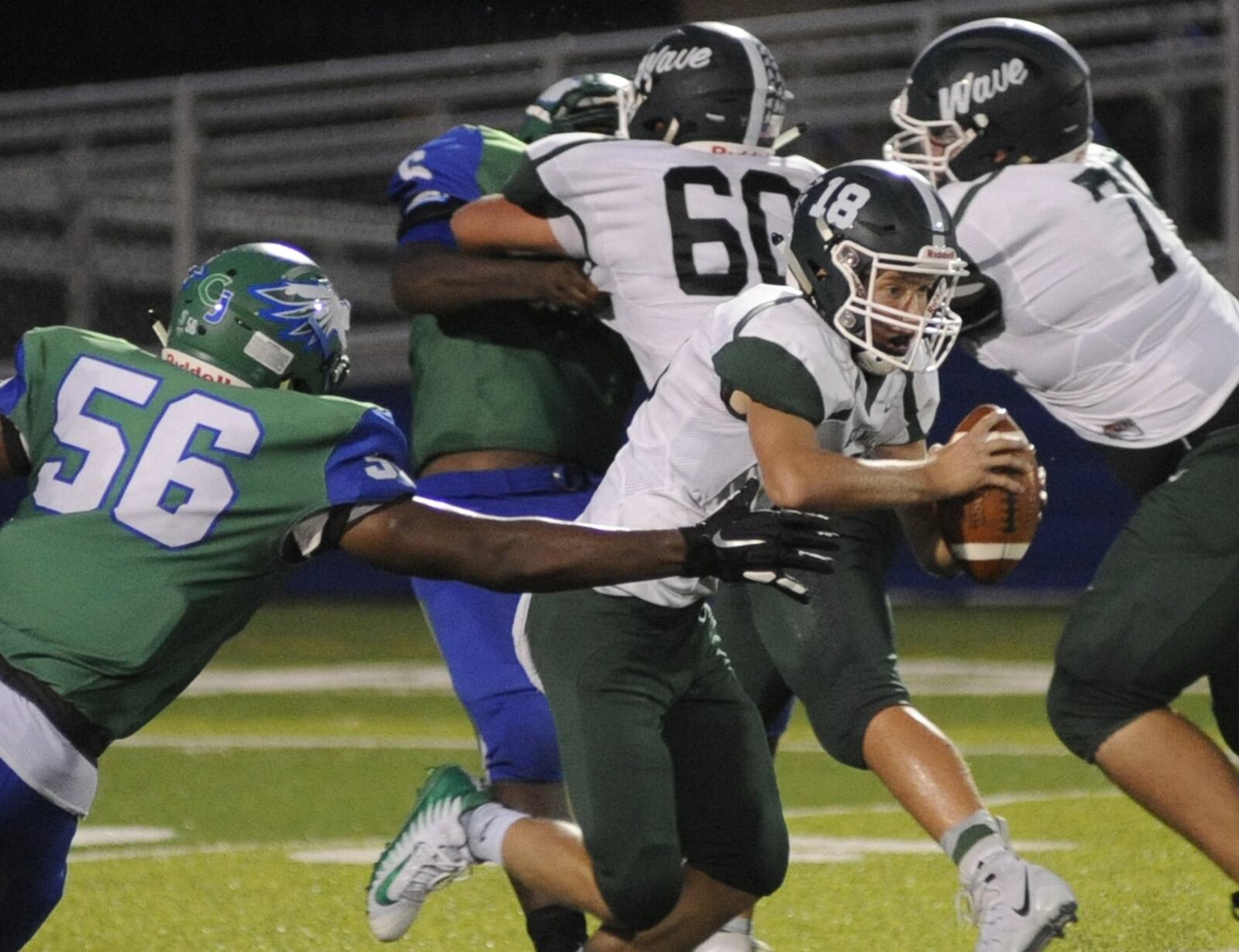 CJ’s Shane Cokes takes down QB Tyler Beyke. Chaminade Julienne defeated visiting Greenville 58-16 in a Week 3 high school football game on Thursday, Sept. 6, 2018. MARC PENDLETON / STAFF