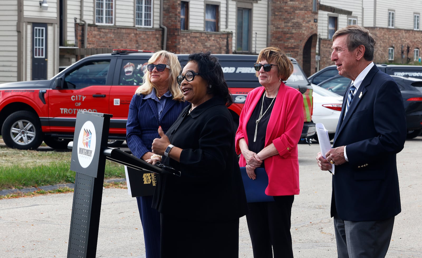 County officials are committing $1 million to demolishing the tornado-damaged Woodland Hills apartments in Trotwood, as well as committing another $200,000 to repairing some of the salvageable units, which was announced on Wednesday, Oct. 23, 2024 during a press conference with (from left) Montgomery County Commissioner Debbie Lieberman, Trotwood Mayor Yvette Page, Montgomery County Commissioner Judy Dodge and Montgomery County Prosecuting Attorney Mat Heck announced that new apartments are coming. MARSHALL GORBY\STAFF