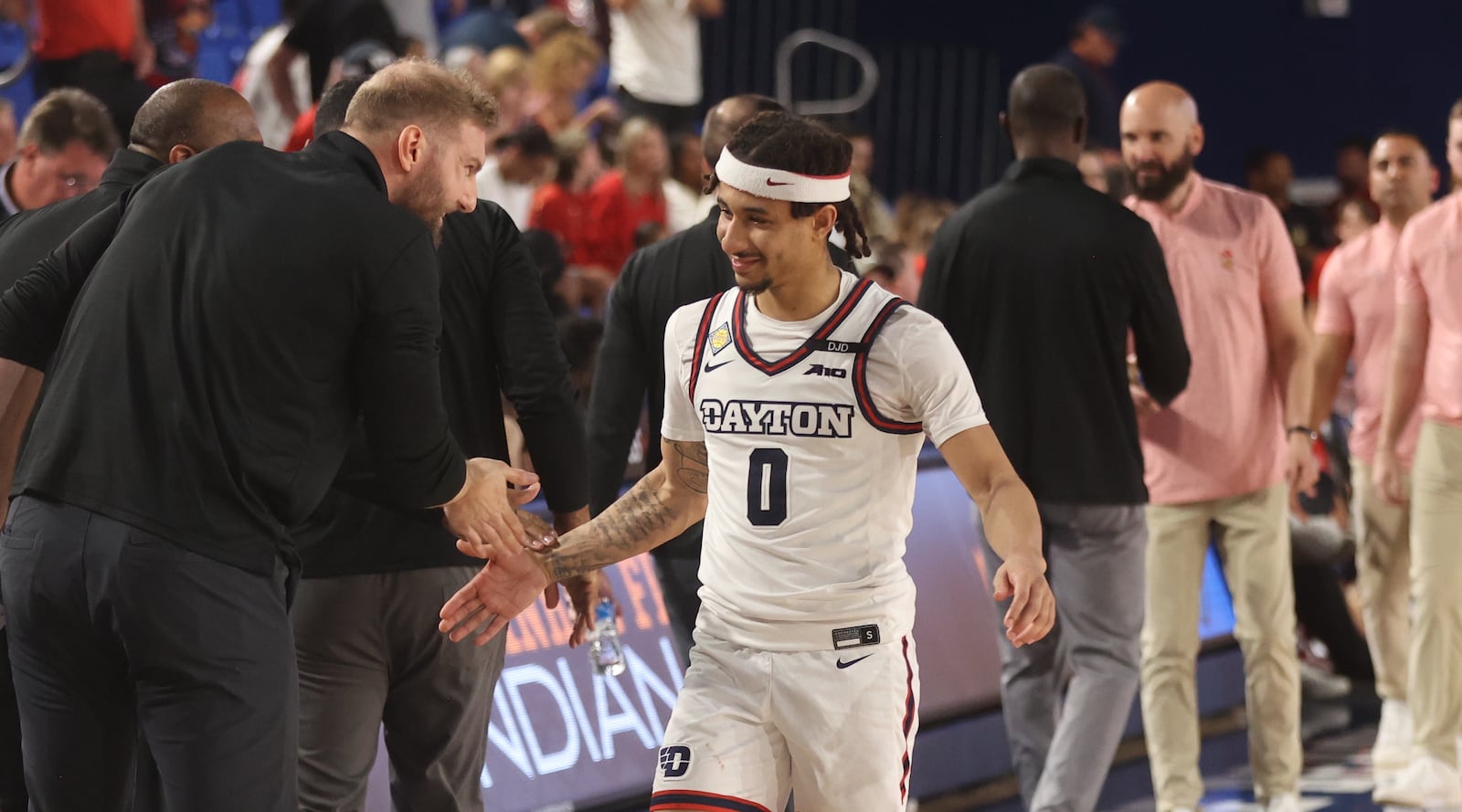 Dayton's Sean Damaska congratulates Javon Bennett after his 30-point performance against Florida Atlantic in the first round of the NIT on Wednesday, March 19, 2025, at Baldwin Arena in Boca Raton, Fla. David Jablonski/Staff